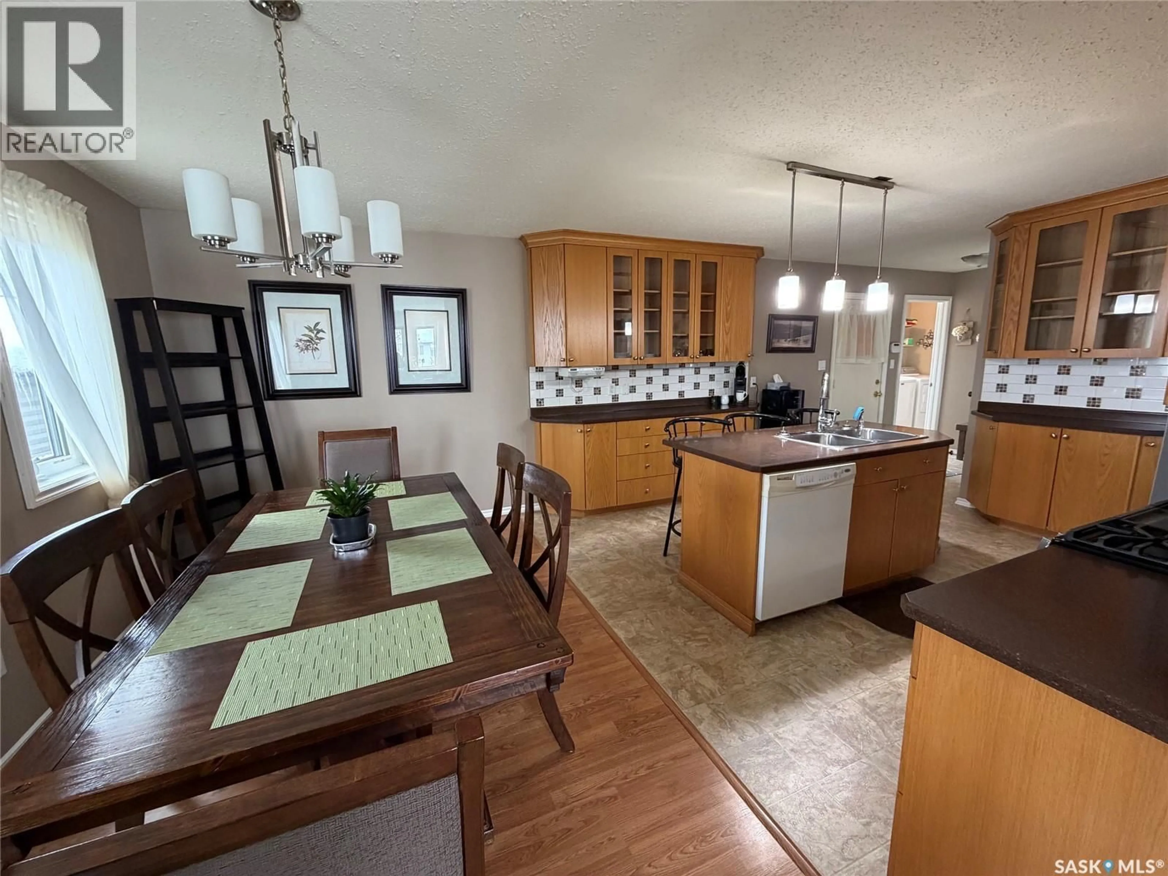 Open concept kitchen, wood/laminate floor for 125 2ND STREET, Spiritwood Saskatchewan S0J2M0