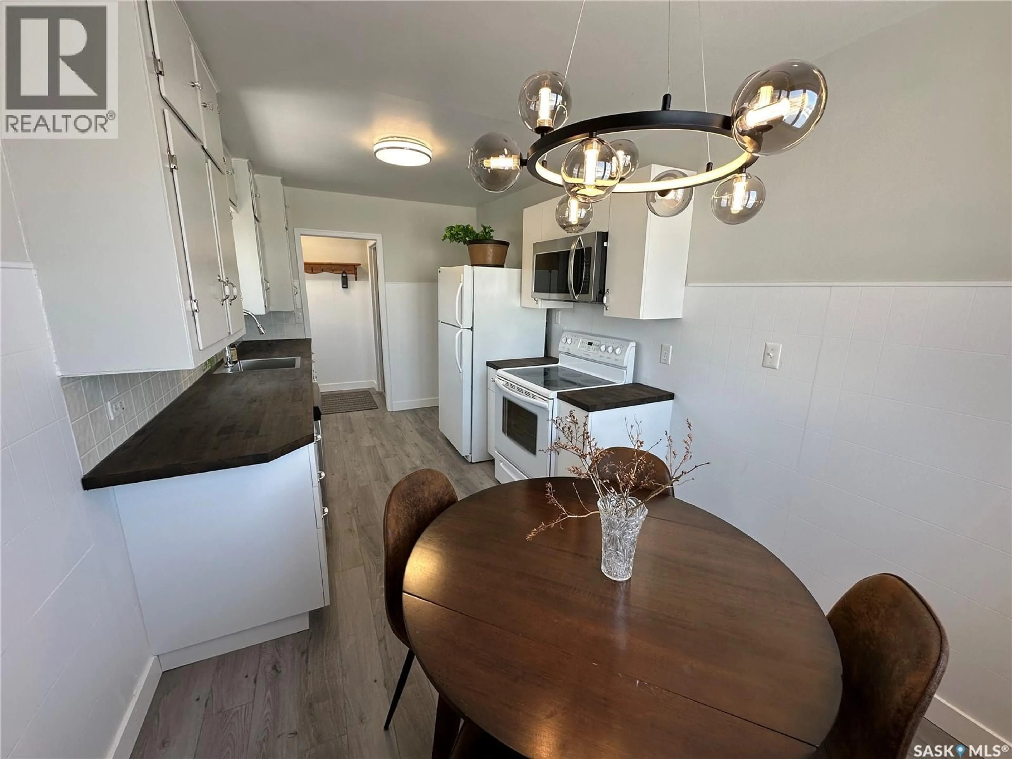 Open concept kitchen, wood/laminate floor for 105 5TH AVENUE, Shellbrook Saskatchewan S0J2E0