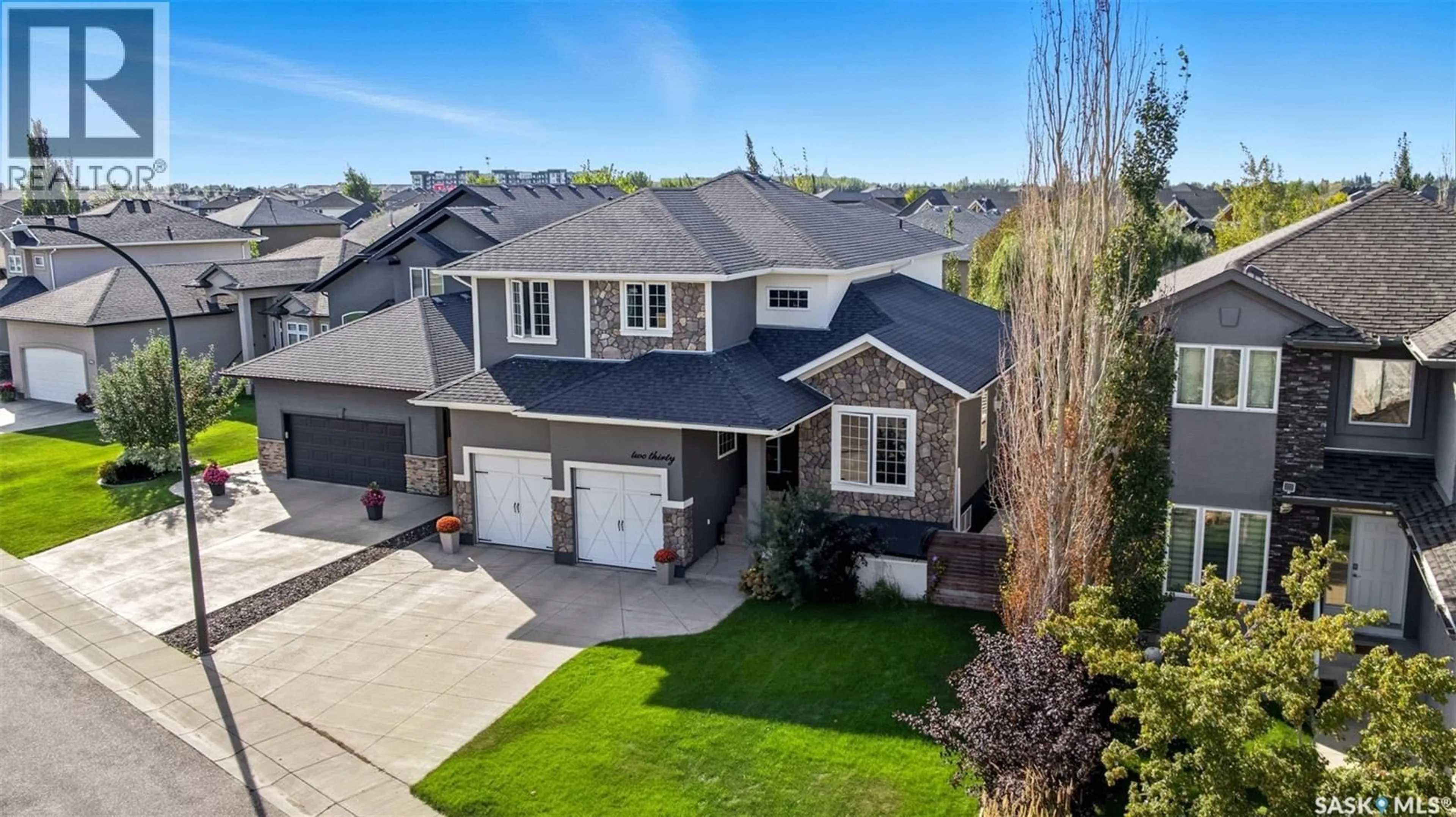 A pic from outside/outdoor area/front of a property/back of a property/a pic from drone, street for 230 TRIMBLE LANE, Saskatoon Saskatchewan S7W0E1