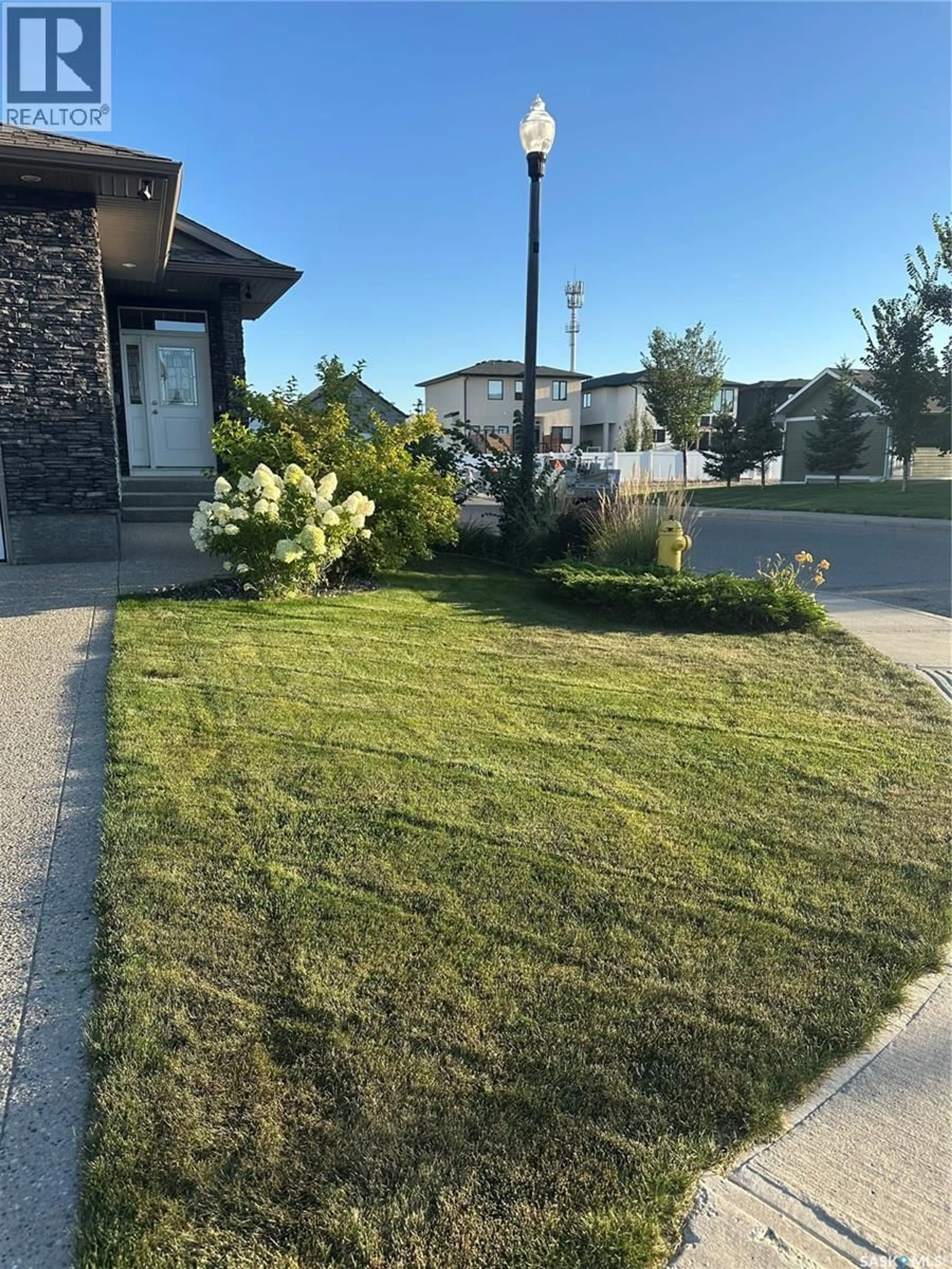 A pic from outside/outdoor area/front of a property/back of a property/a pic from drone, street for 4301 GREEN POPLAR LANE, Regina Saskatchewan S4V1R1