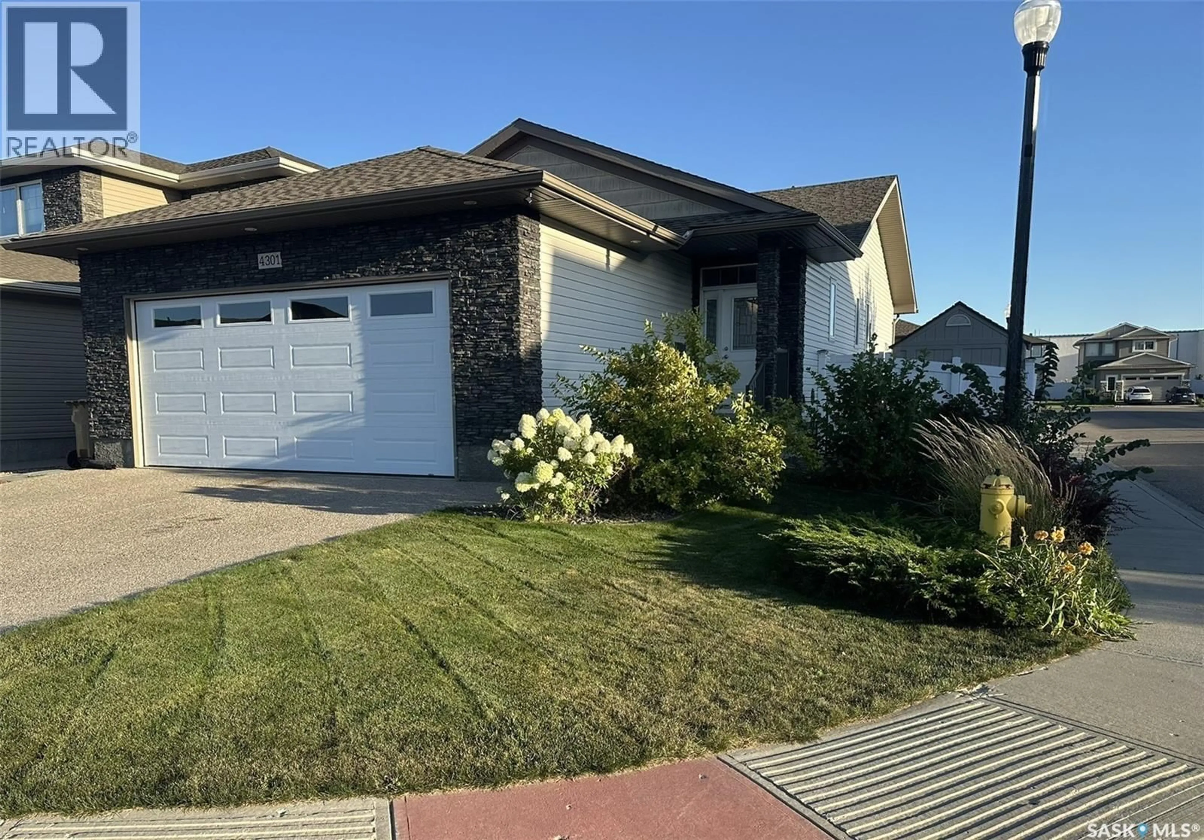 Home with vinyl exterior material, street for 4301 GREEN POPLAR LANE, Regina Saskatchewan S4V1R1