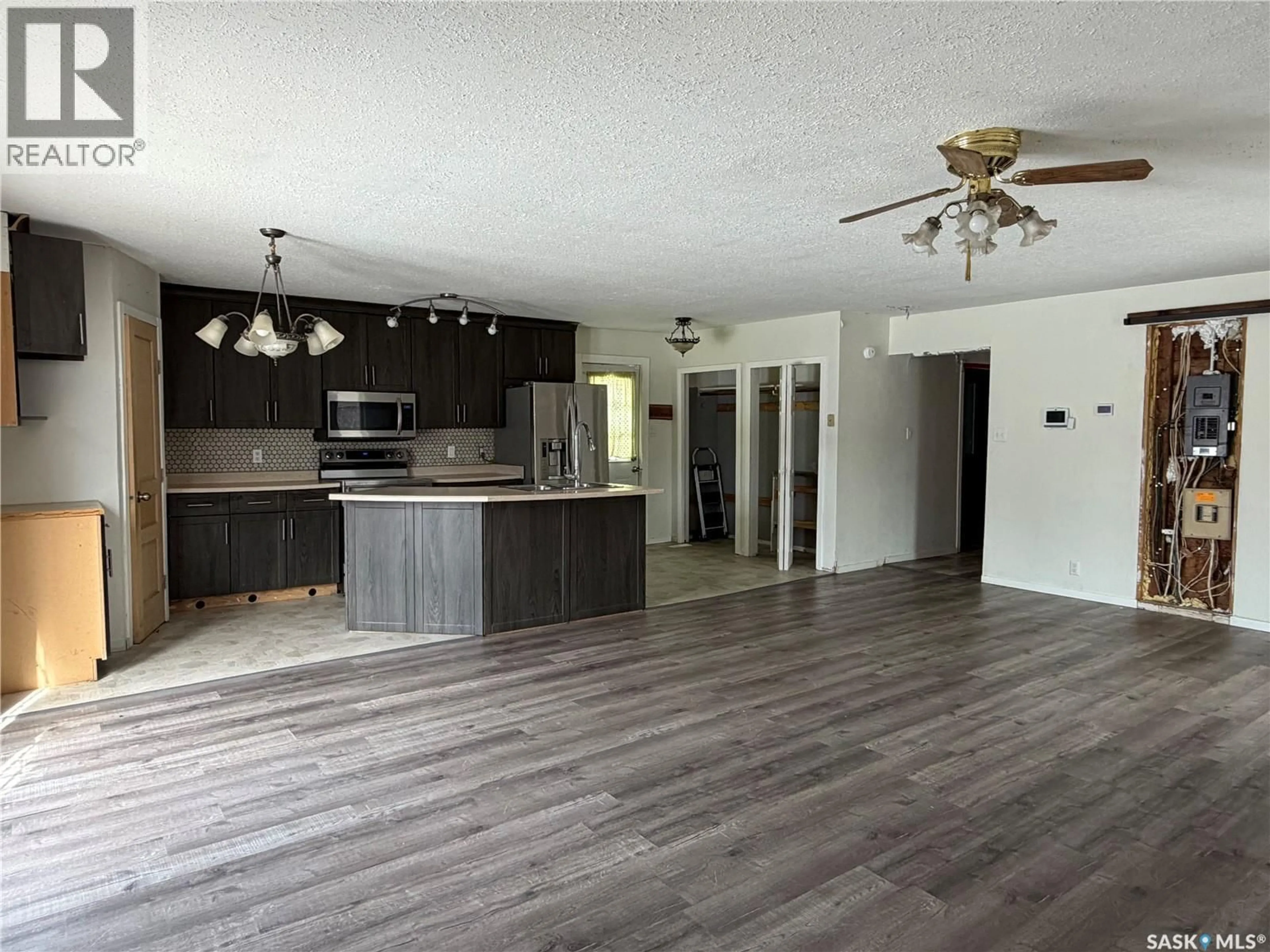 Open concept kitchen, wood/laminate floor for 407 2ND STREET, Meadow Lake Saskatchewan S9X1E8