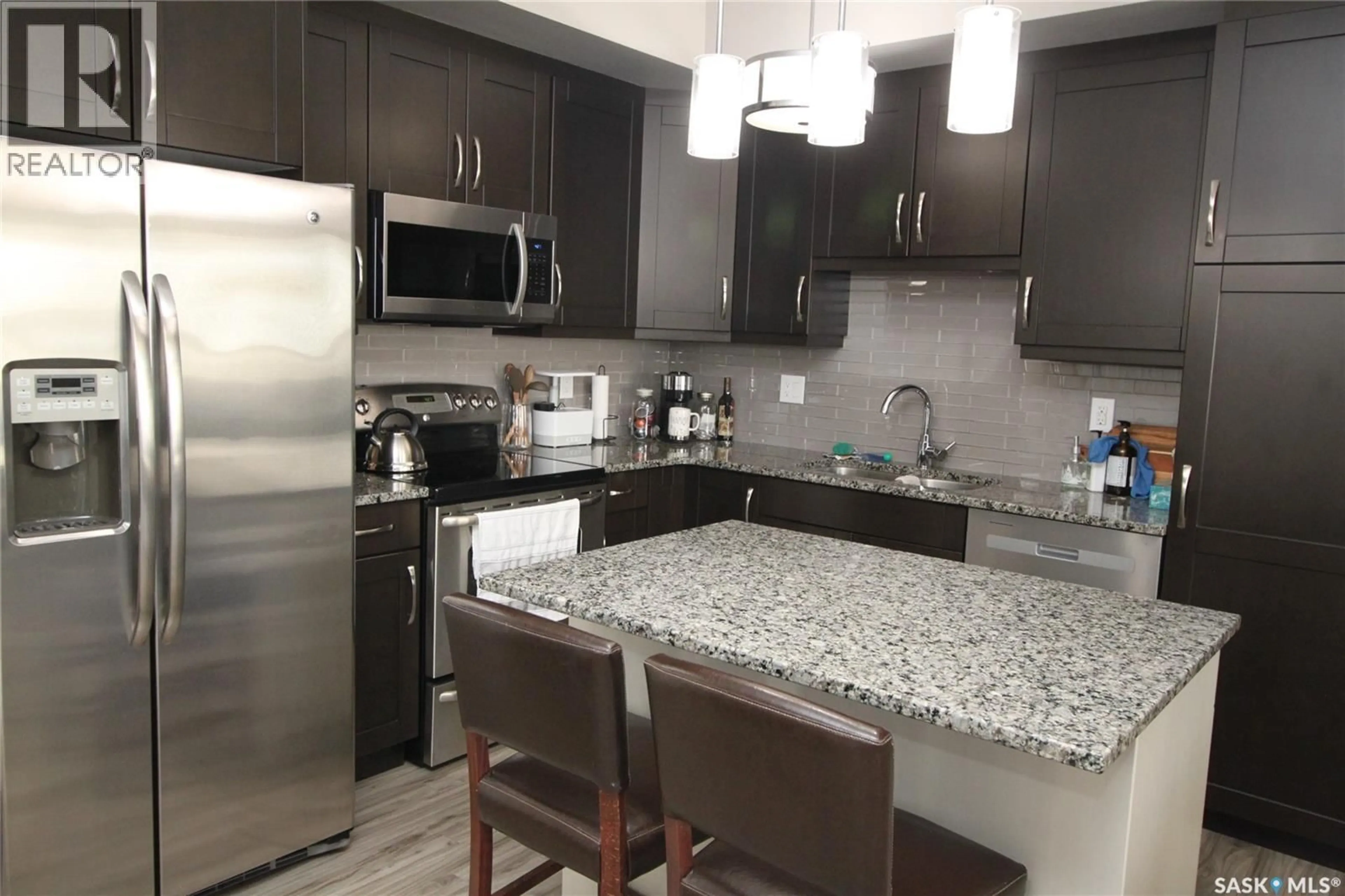Open concept kitchen, ceramic/tile floor for 1035 - 317 MOSS AVENUE, Saskatoon Saskatchewan S7H4M4