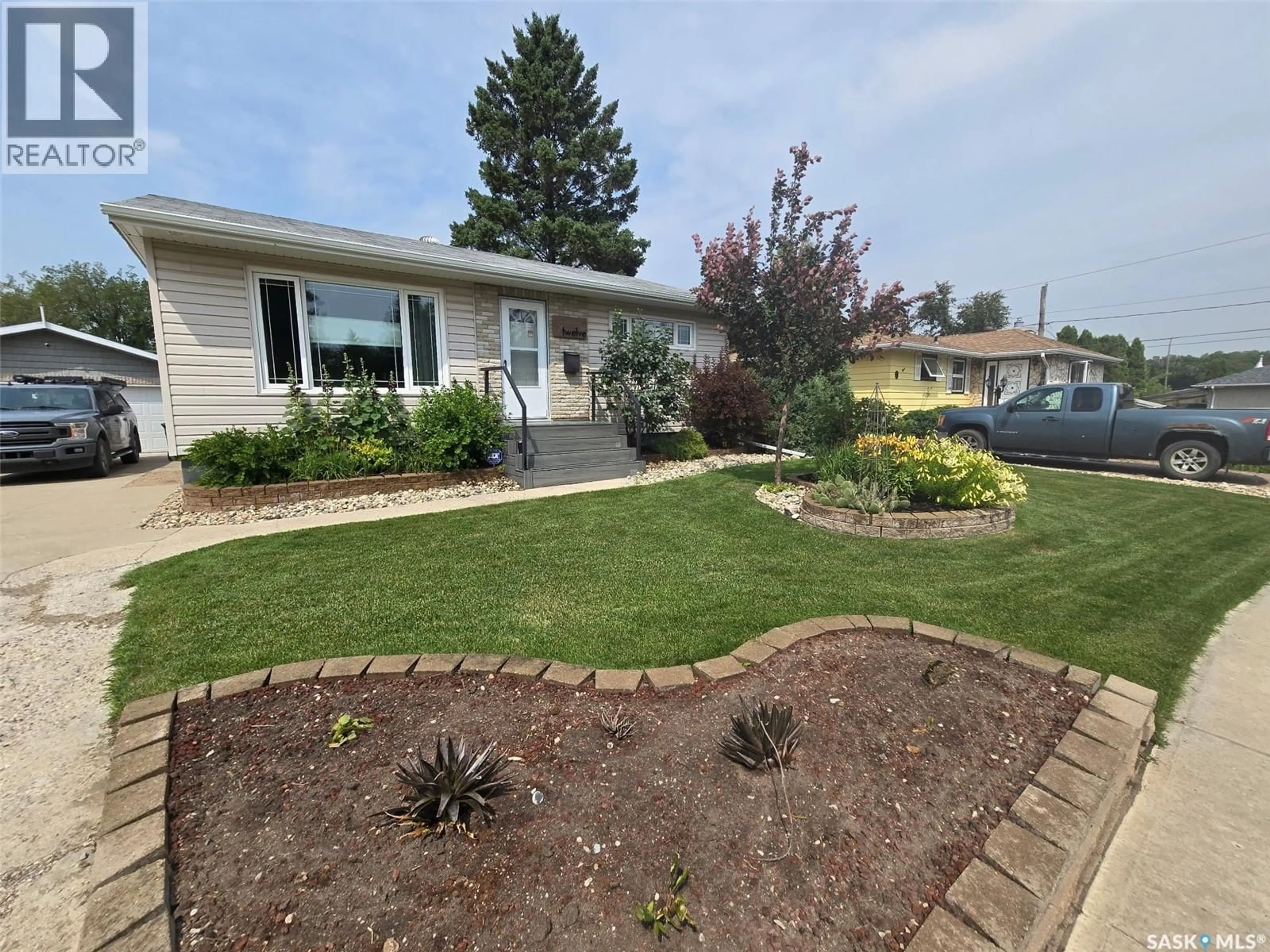 A pic from outside/outdoor area/front of a property/back of a property/a pic from drone, street for 12 SECORD PLACE, Regina Saskatchewan S4R3T4