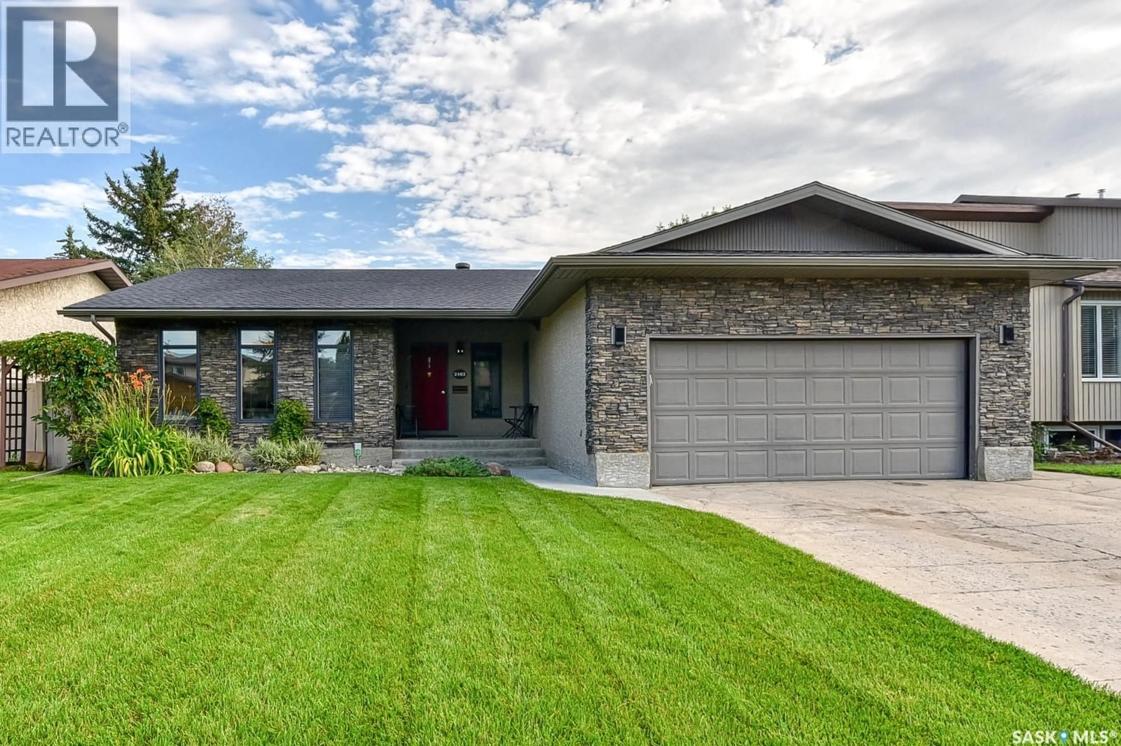 Home with brick exterior material, street for 2102 TRUESDALE DRIVE, Regina Saskatchewan S4V0M5