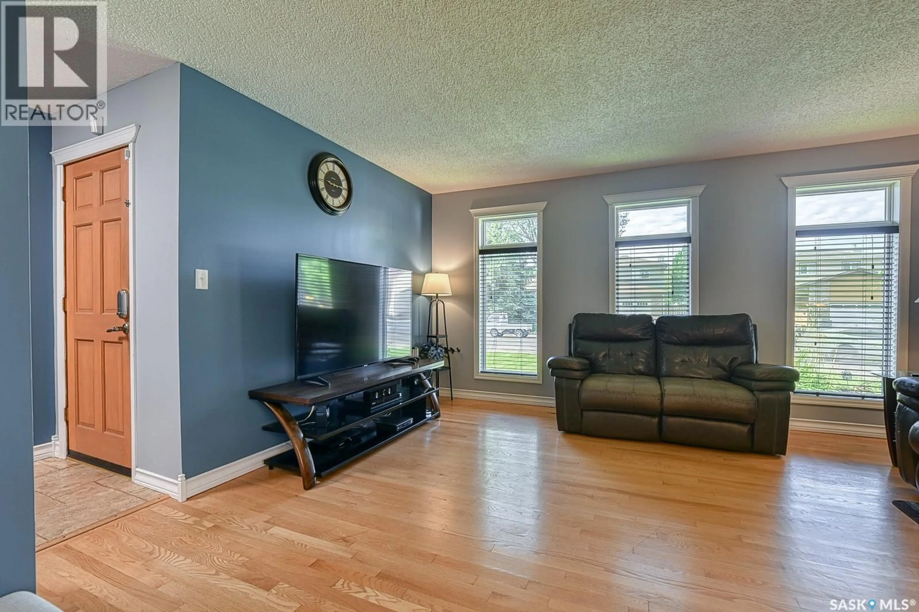 Living room with furniture, wood/laminate floor for 2102 TRUESDALE DRIVE, Regina Saskatchewan S4V0M5