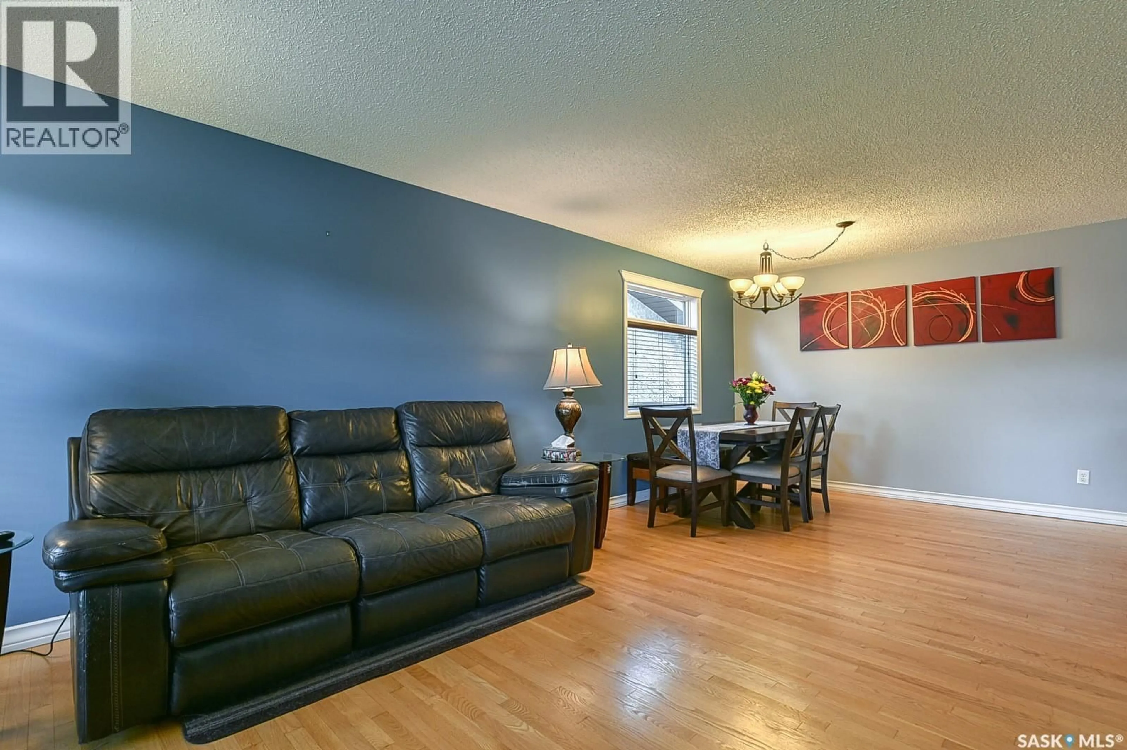 Living room with furniture, wood/laminate floor for 2102 TRUESDALE DRIVE, Regina Saskatchewan S4V0M5