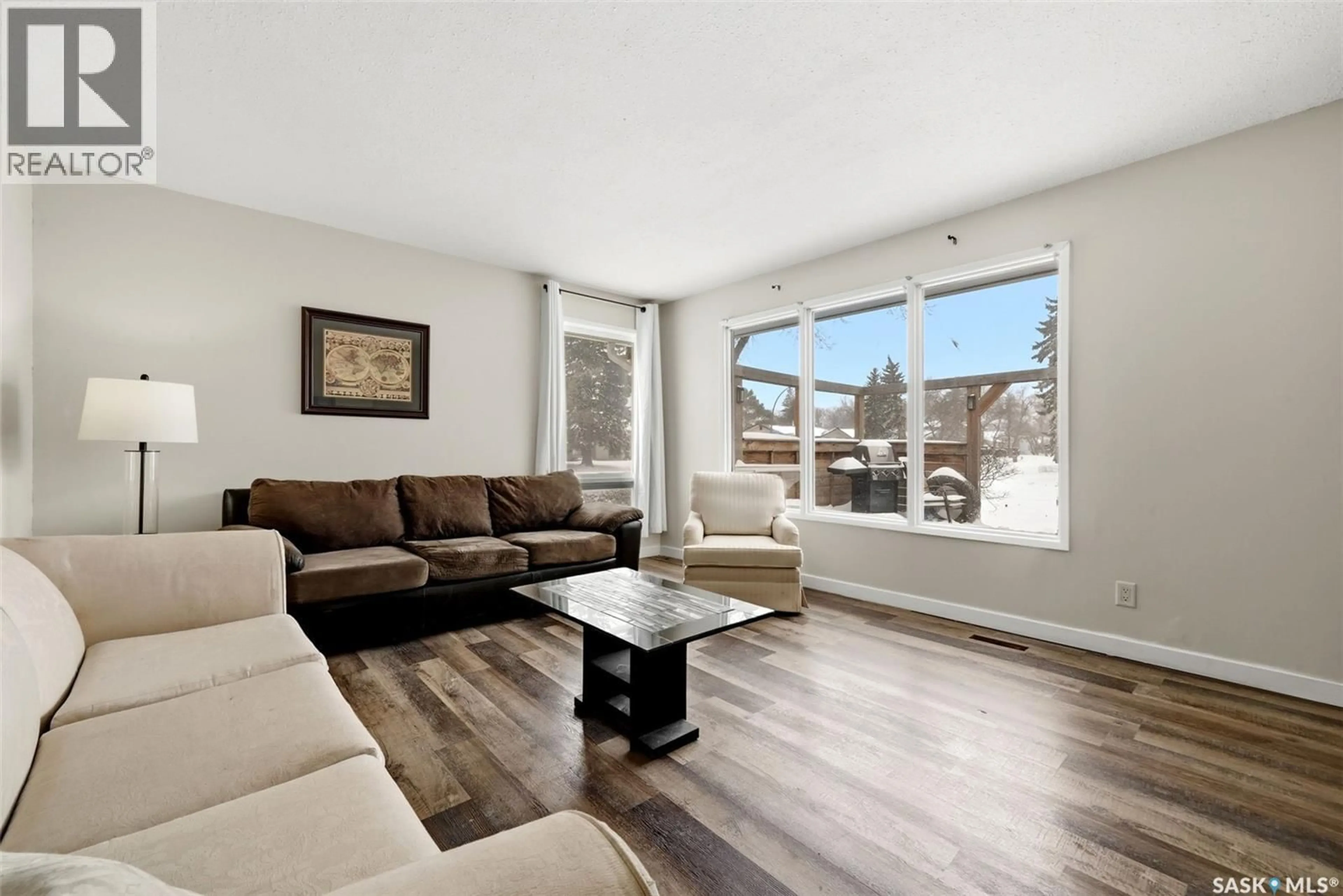 Living room with furniture, wood/laminate floor for 6 HANLEY CRESCENT, Regina Saskatchewan S4R5A7
