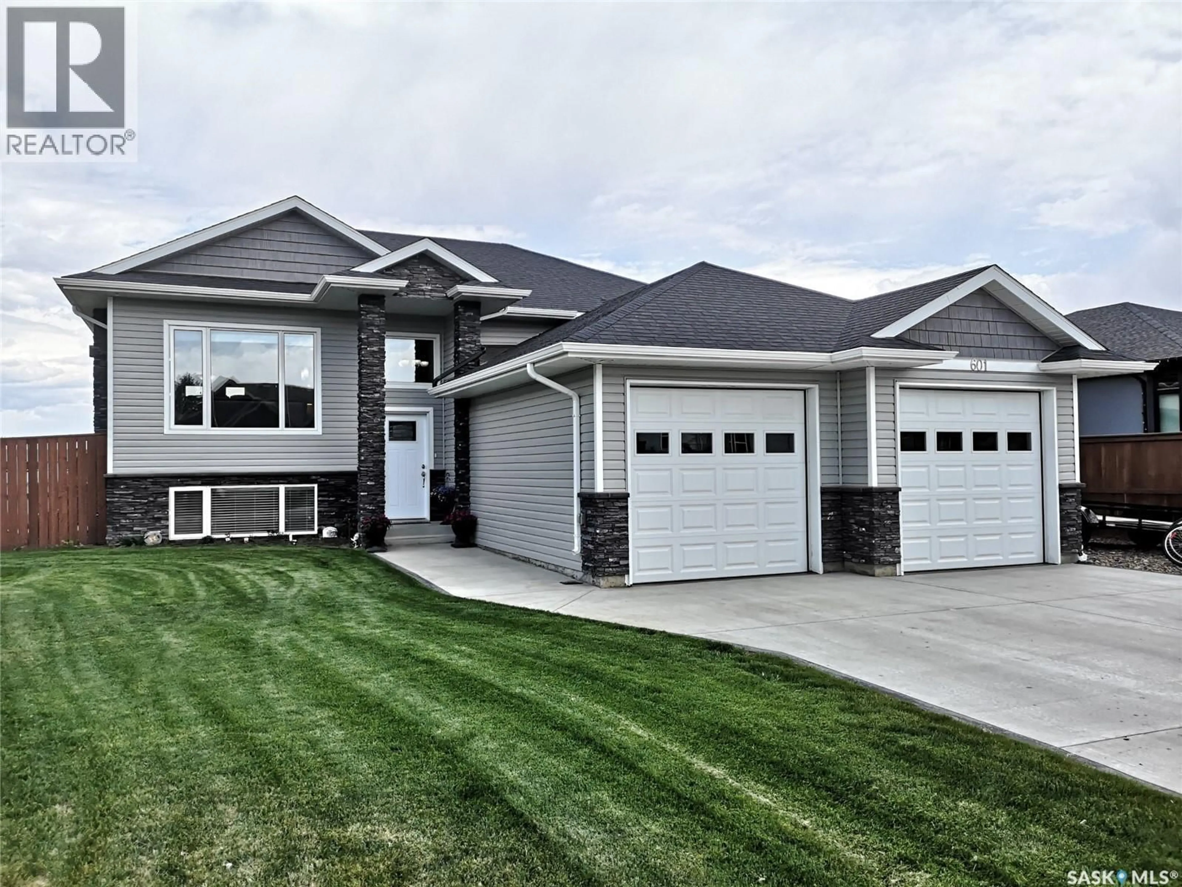 Home with vinyl exterior material, street for 601 SELKIRK STREET, Outlook Saskatchewan S0L2N0
