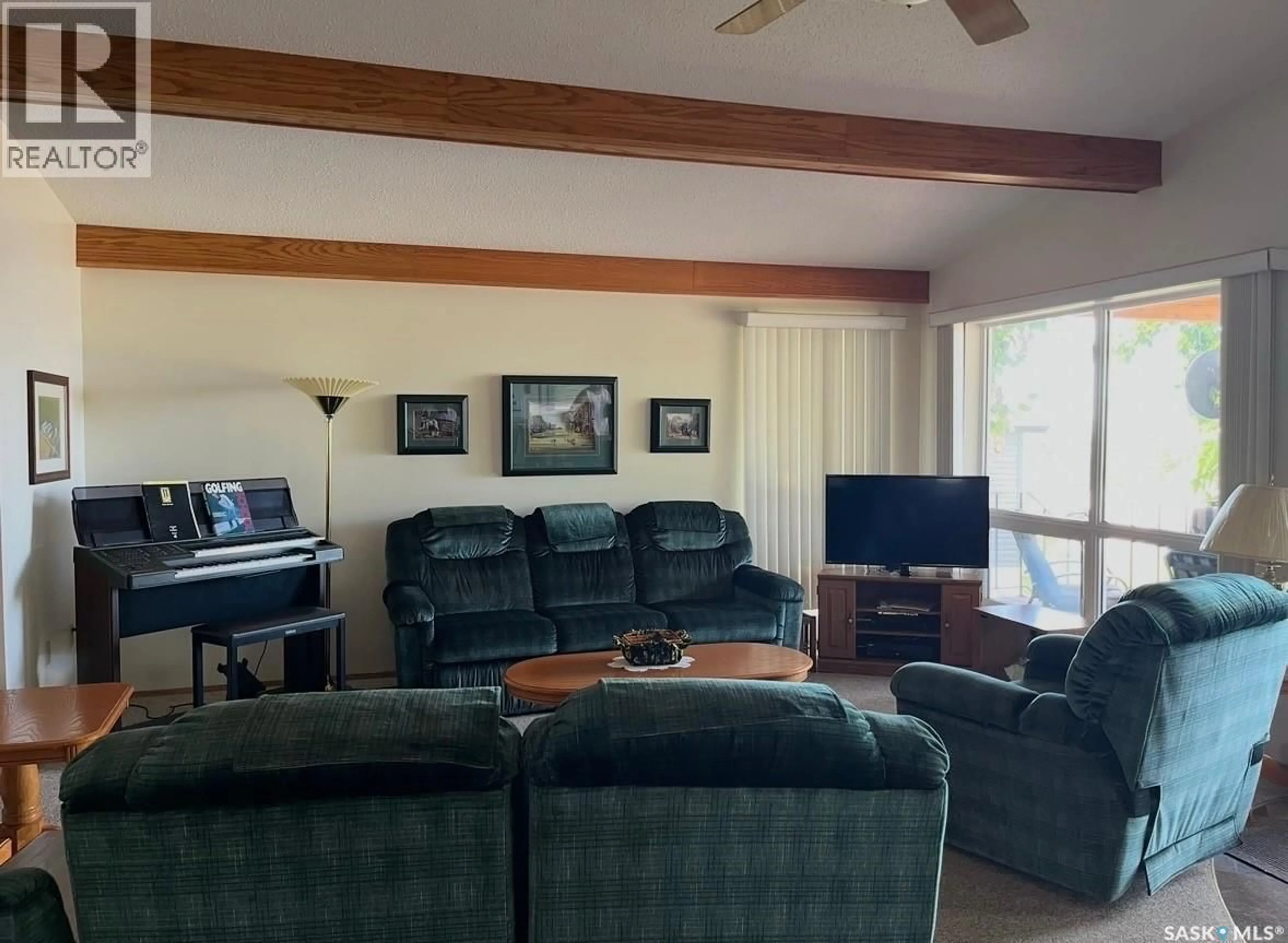Living room with furniture, wood/laminate floor for 28 HIGHLAND AVENUE, Meota Rm No.468 Saskatchewan S0M0L0