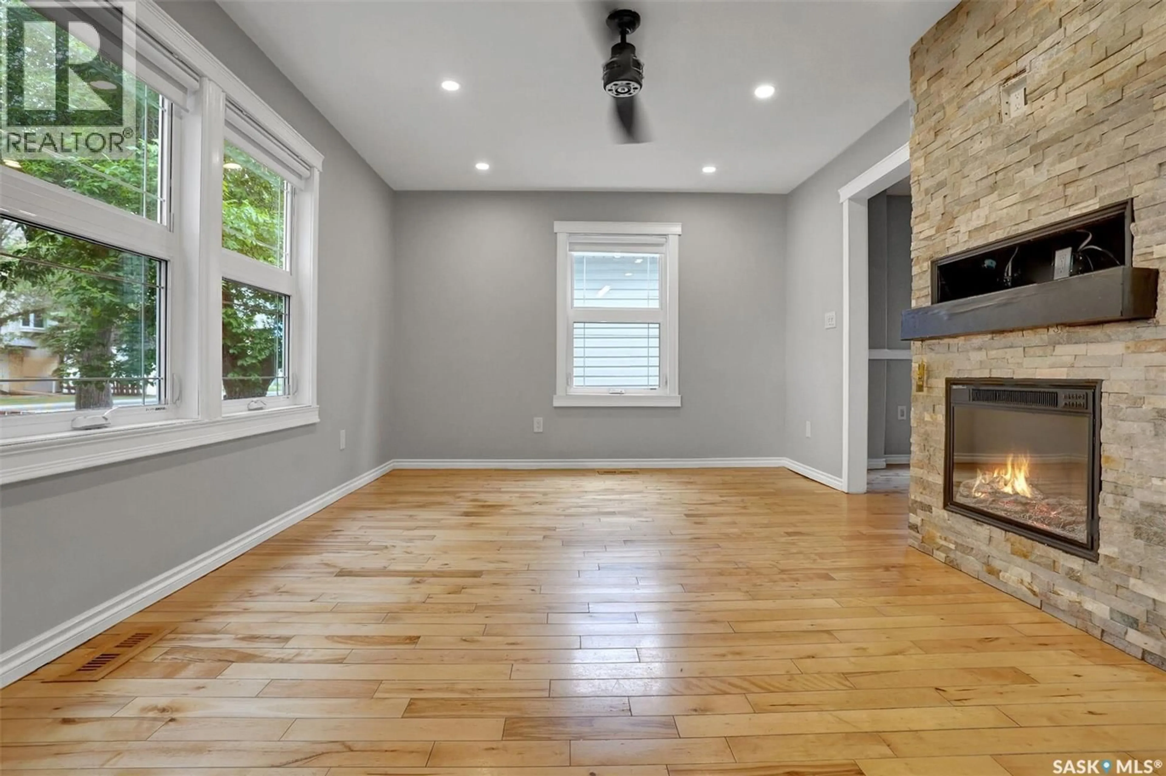 Living room with furniture, wood/laminate floor for 1143 WASCANA STREET, Regina Saskatchewan S4T4H9