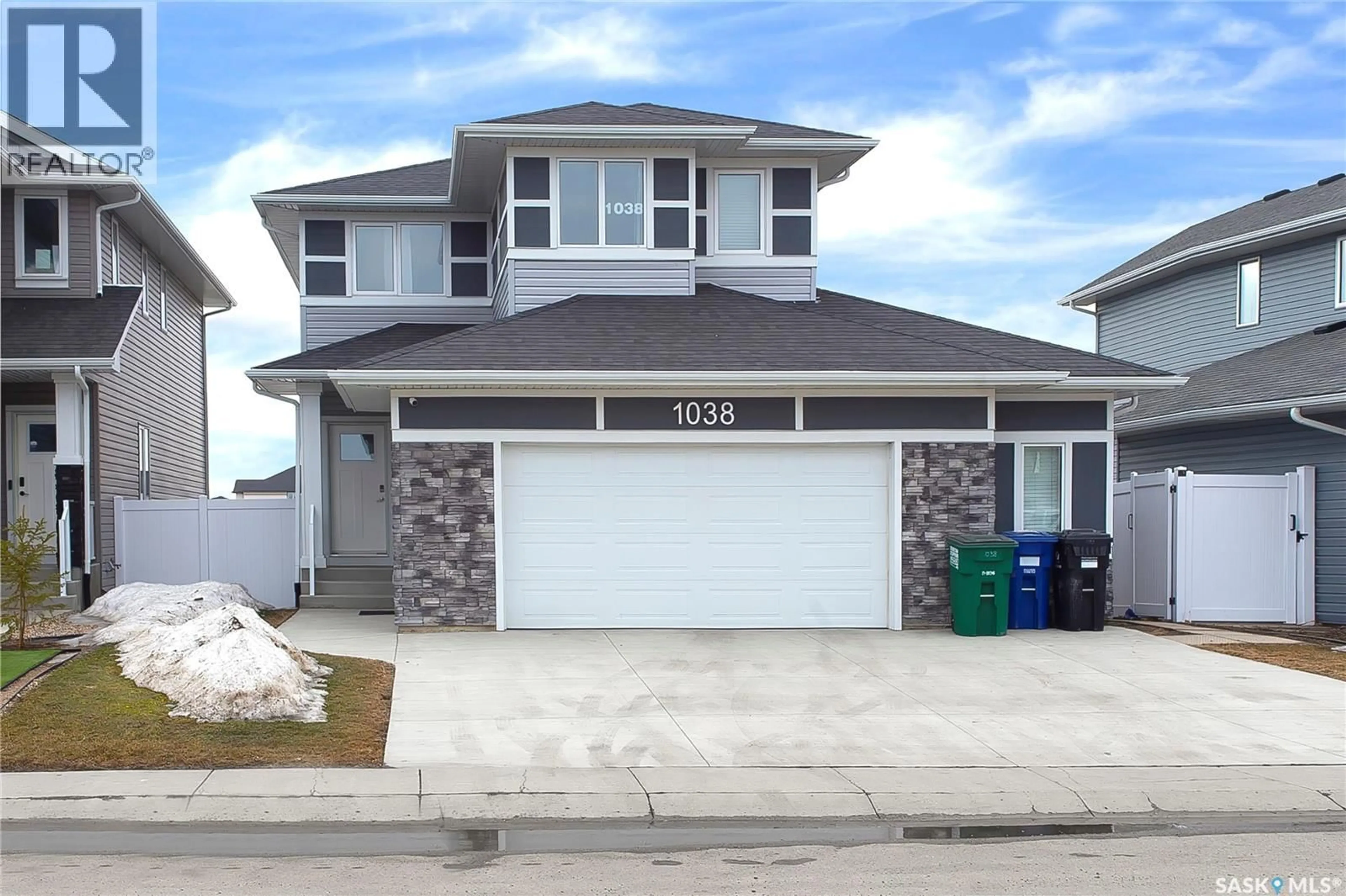 Home with vinyl exterior material, street for 1038 CHILDERS COURT, Saskatoon Saskatchewan S7L6T8