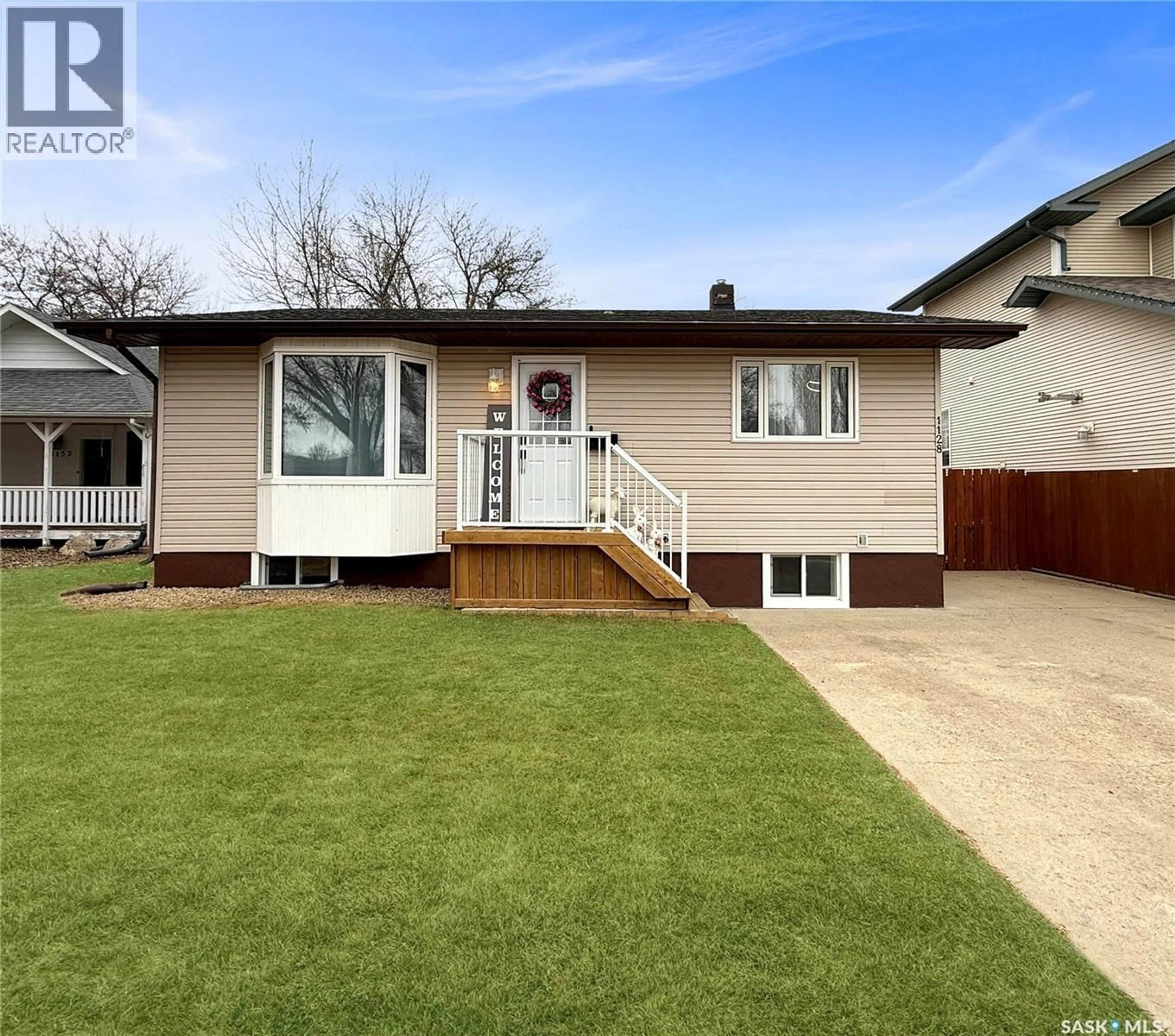 Home with vinyl exterior material, street for 1128 SIDNEY STREET, Swift Current Saskatchewan S9H1T9