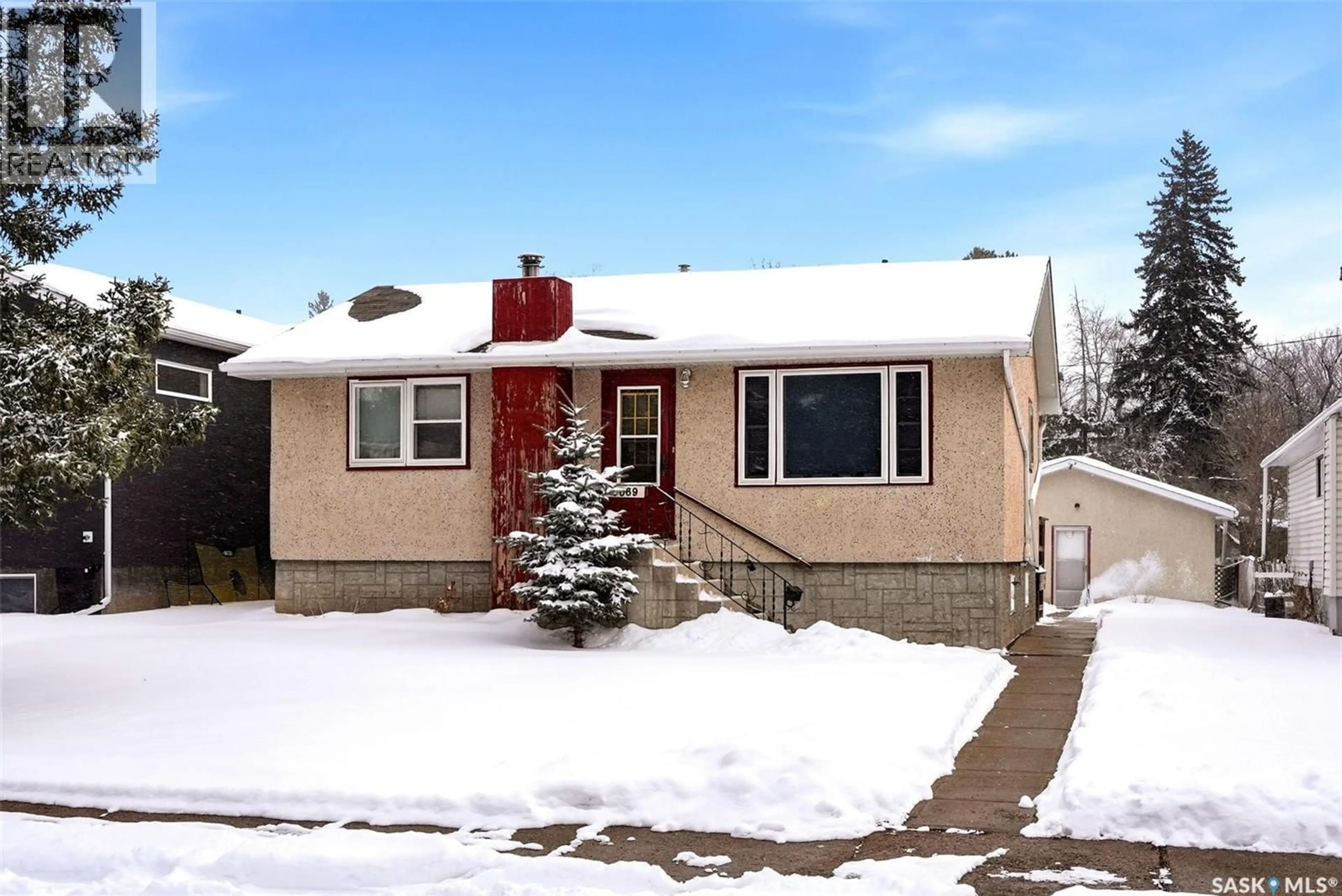 Home with vinyl exterior material, street for 3069 ELPHINSTONE STREET, Regina Saskatchewan S4S2A6