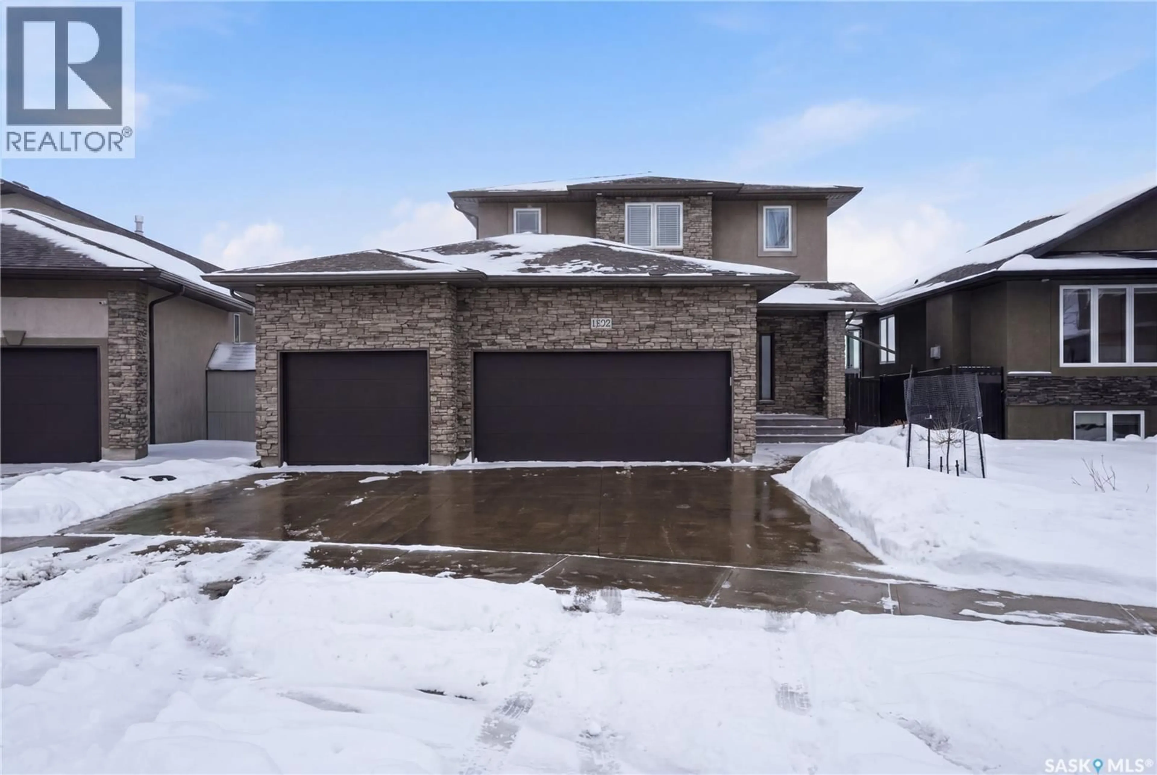 Home with brick exterior material, street for 1532 MAPLE HILL CRESCENT, Regina Saskatchewan S4X0E8