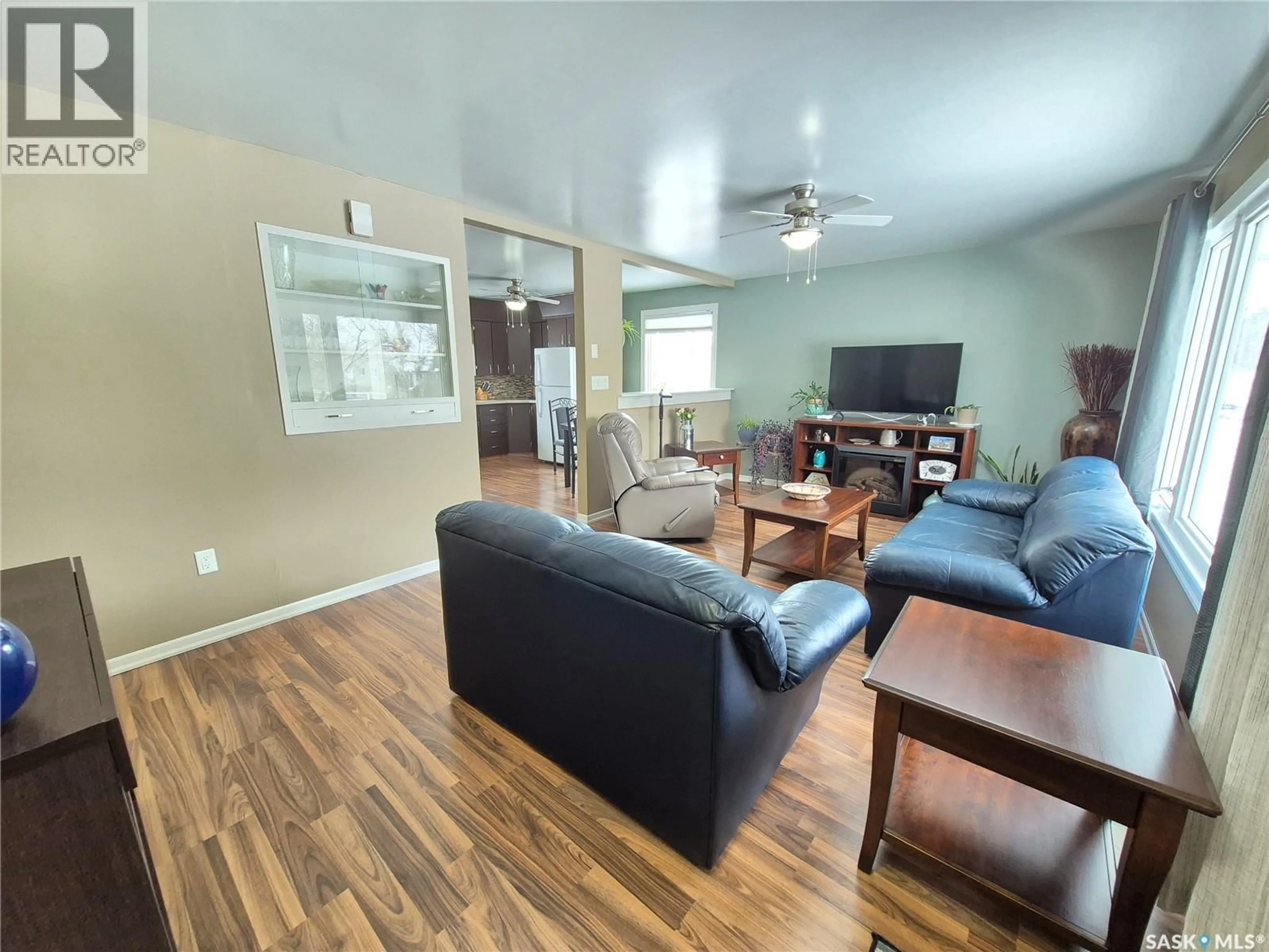 Living room with furniture, wood/laminate floor for 309 FREDERICK STREET, Ogema Saskatchewan S0C1Y0