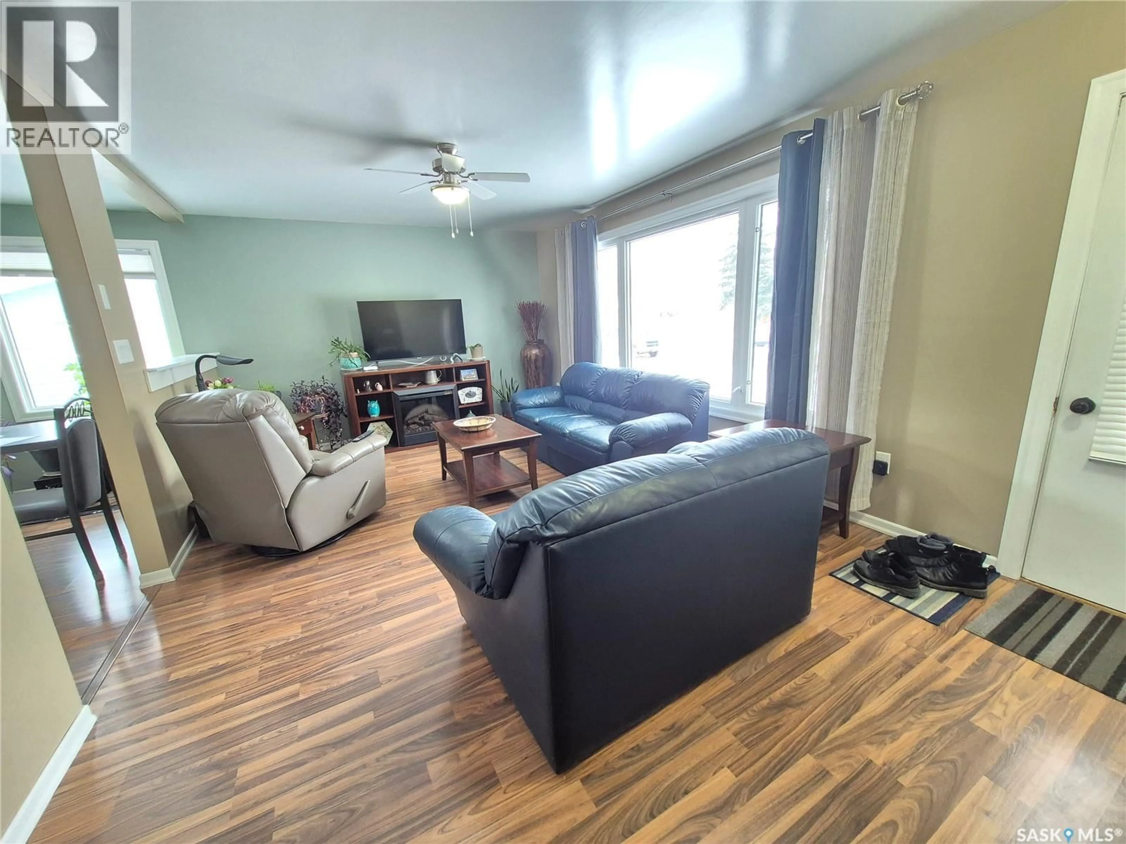Living room with furniture, wood/laminate floor for 309 FREDERICK STREET, Ogema Saskatchewan S0C1Y0