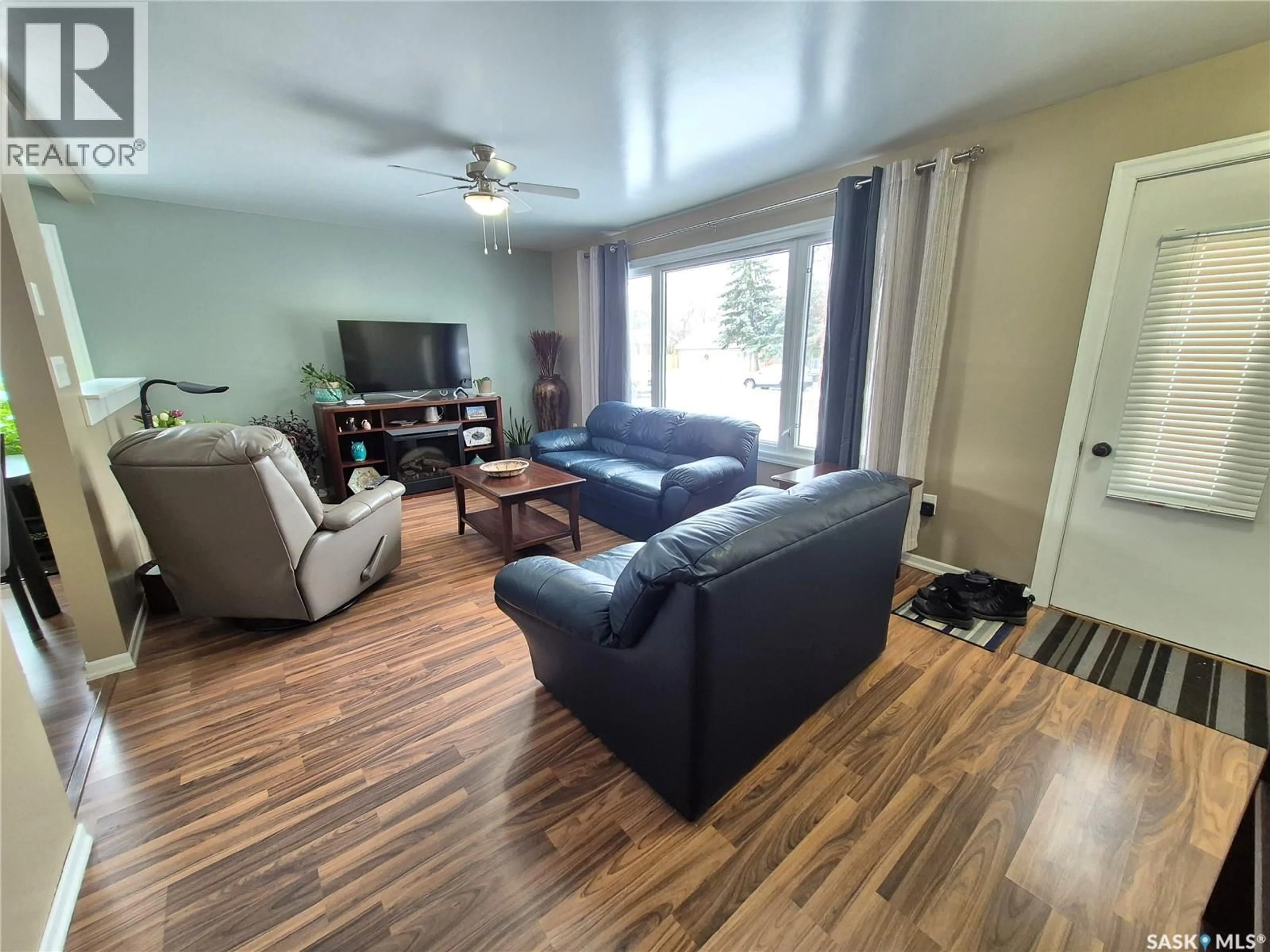 Living room with furniture, wood/laminate floor for 309 FREDERICK STREET, Ogema Saskatchewan S0C1Y0