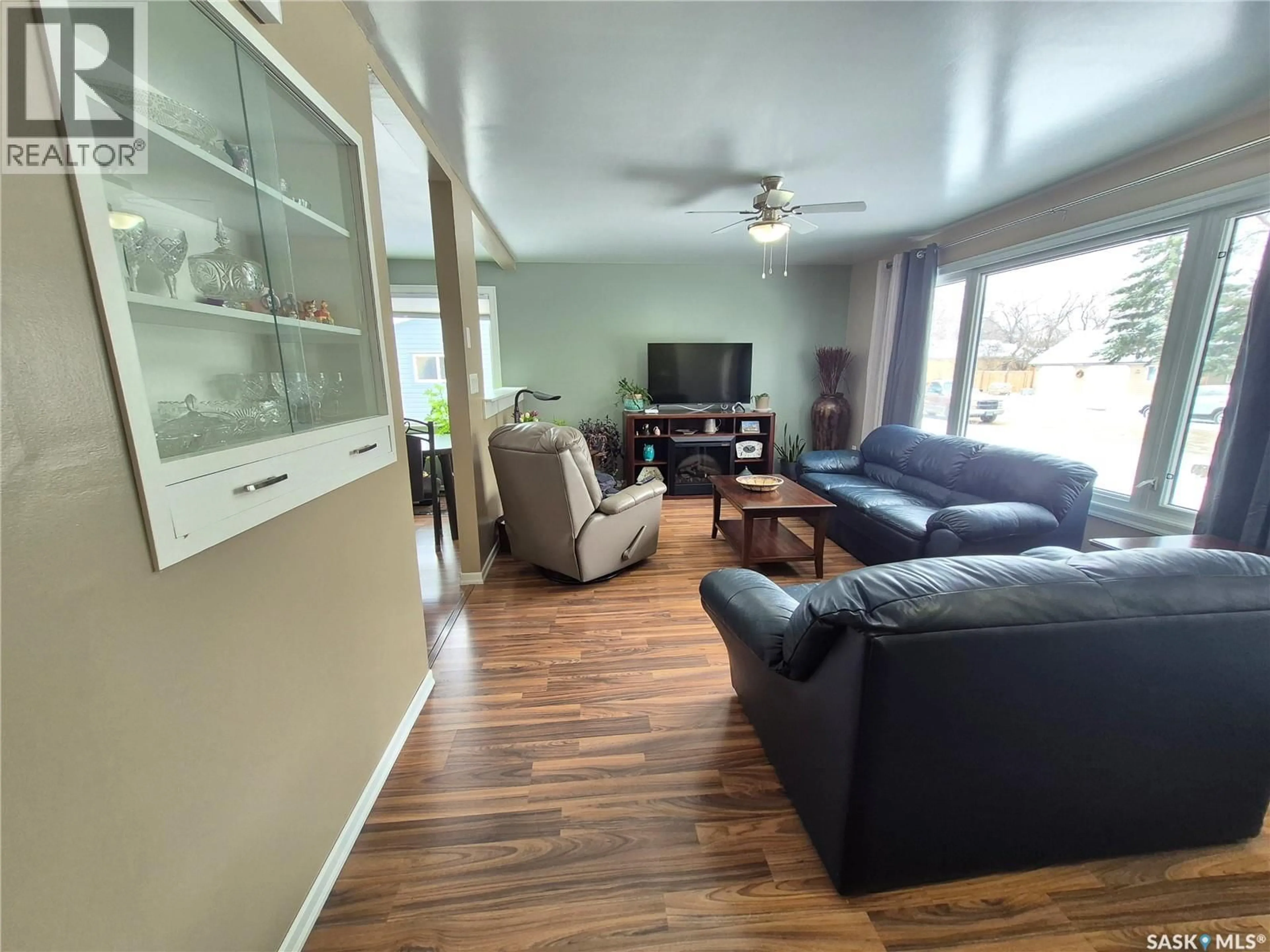 Living room with furniture, wood/laminate floor for 309 FREDERICK STREET, Ogema Saskatchewan S0C1Y0