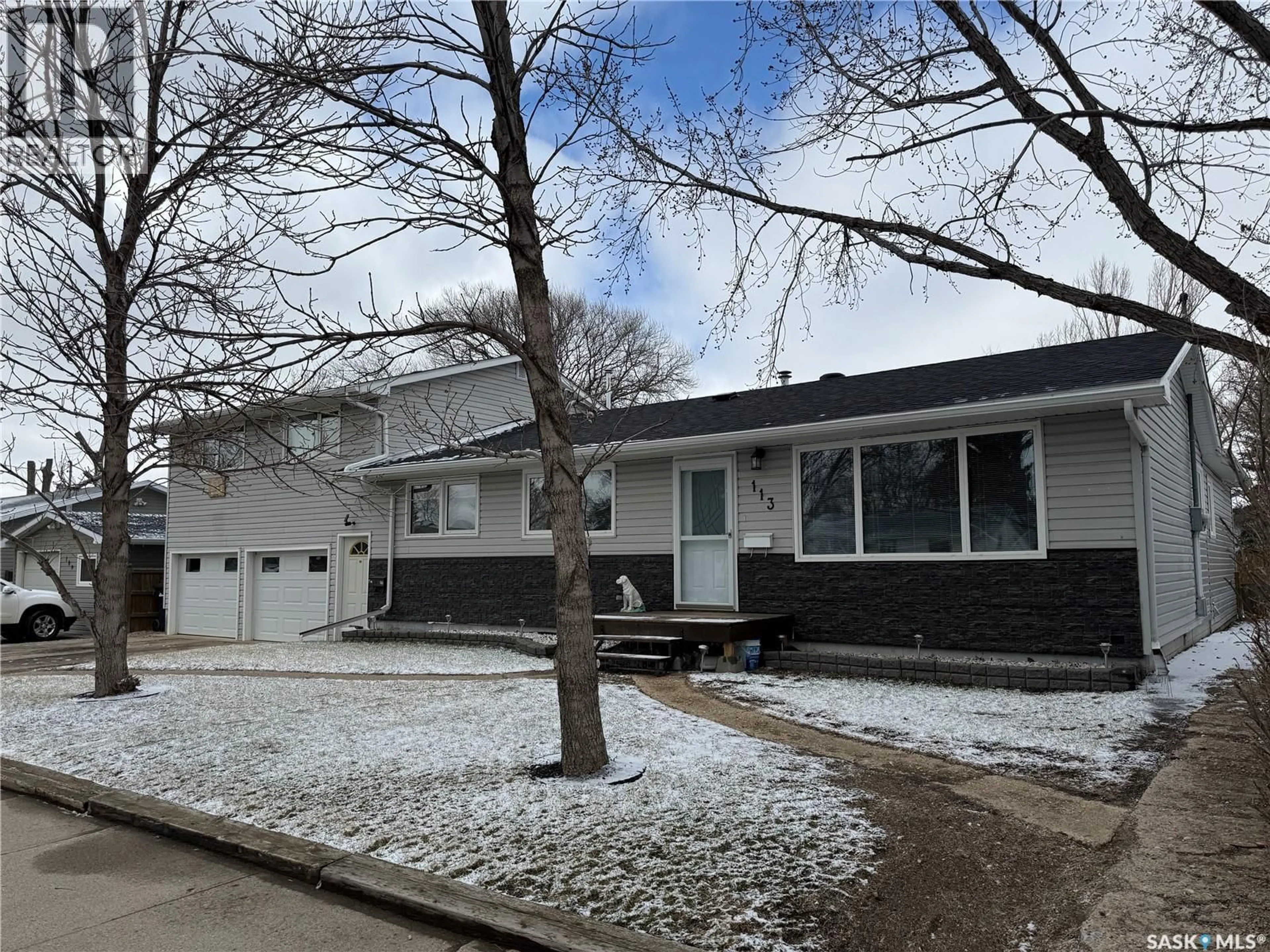 Home with vinyl exterior material, street for 113 7TH AVENUE, Weyburn Saskatchewan S4H1Z3