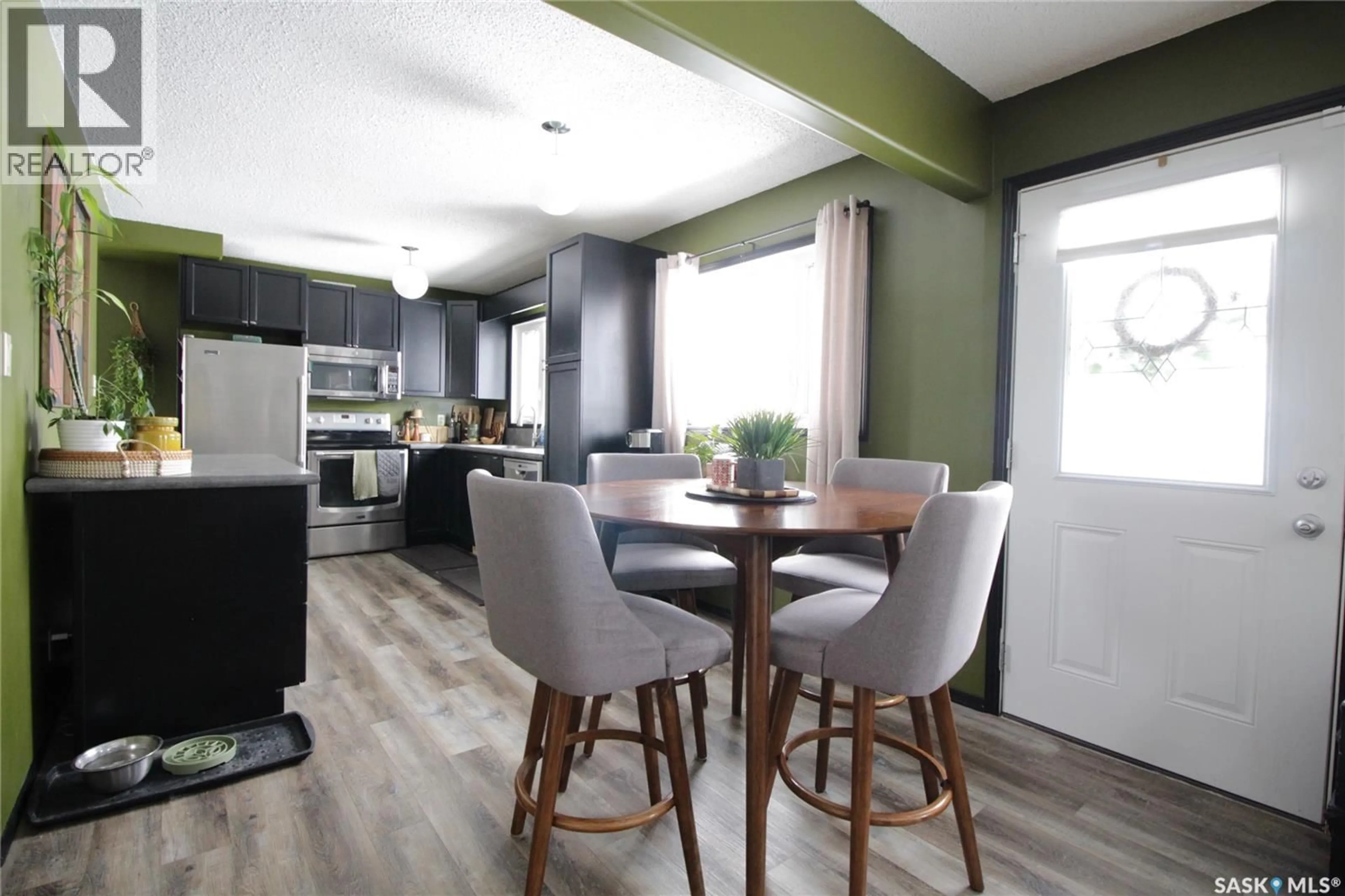 Open concept kitchen, wood/laminate floor for 1110 ROBIN AVENUE, Rocanville Saskatchewan S0A3L0