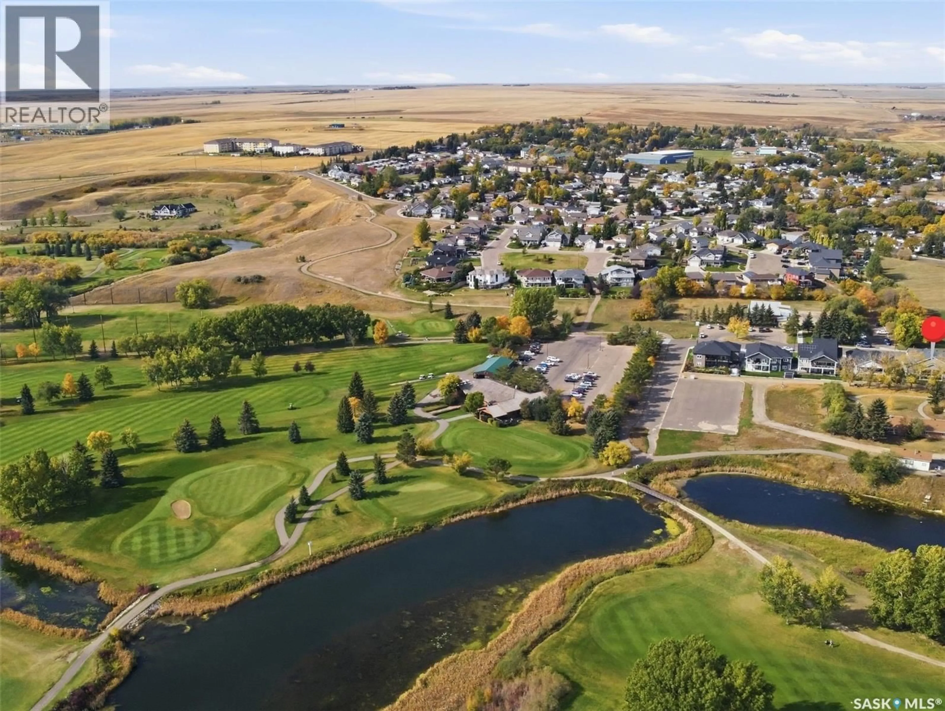 A pic from outside/outdoor area/front of a property/back of a property/a pic from drone, water/lake/river/ocean view for 551 6TH AVENUE, Swift Current Saskatchewan S9H3P5