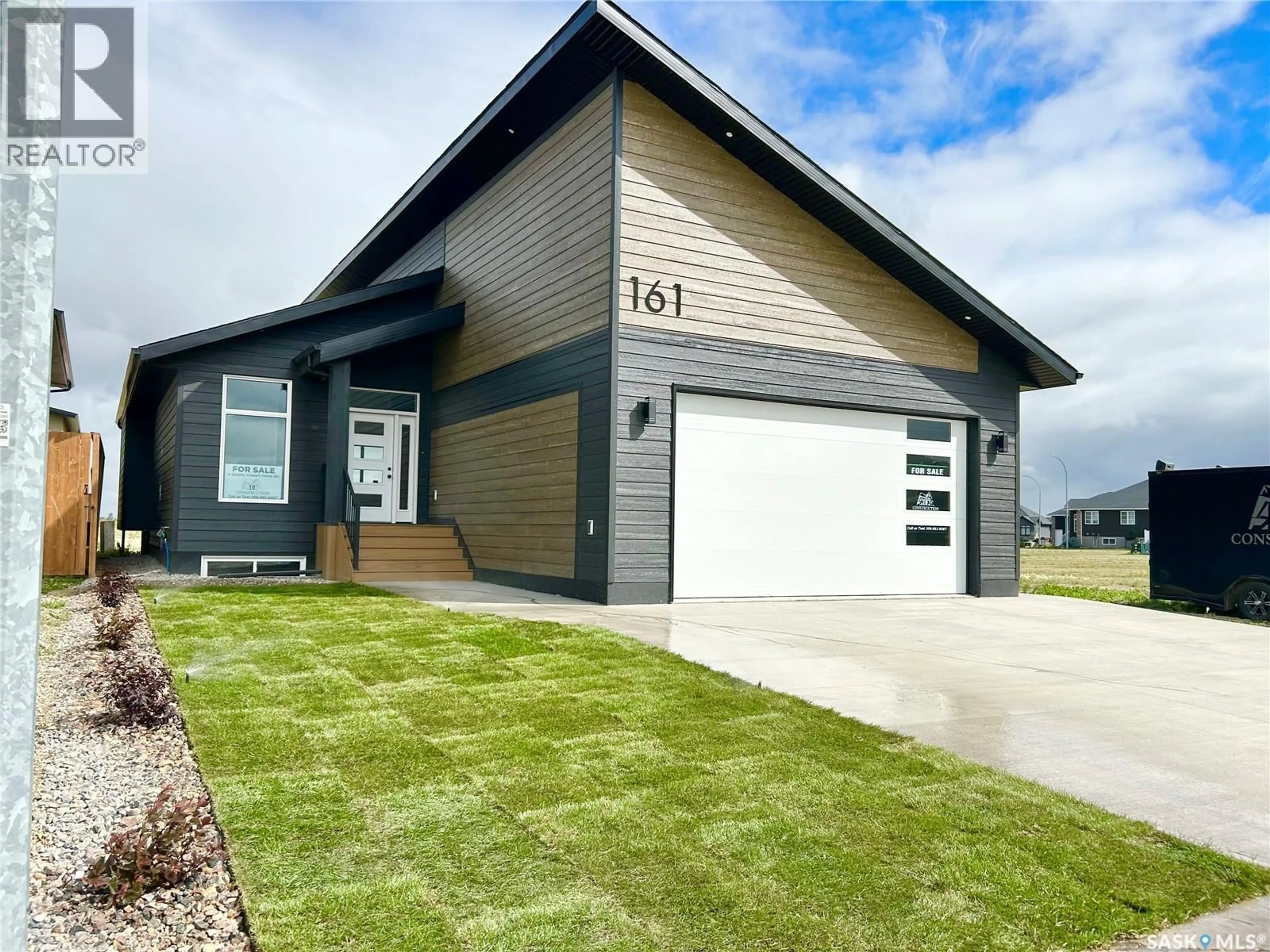 Home with vinyl exterior material, street for 161 DELAET DRIVE, Weyburn Saskatchewan S4H3B9