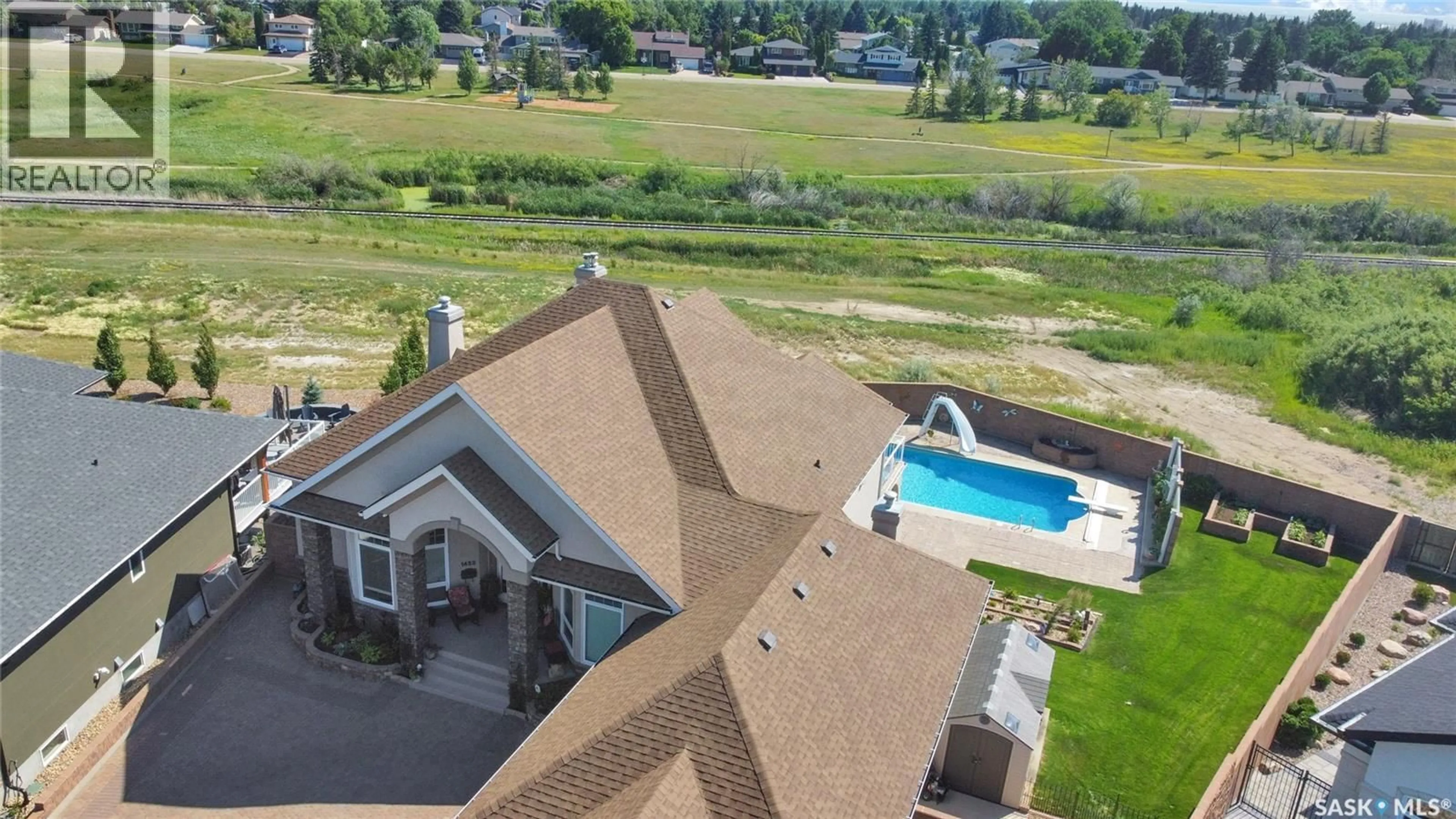 A pic from outside/outdoor area/front of a property/back of a property/a pic from drone, water/lake/river/ocean view for 1453 NORMANDY DRIVE, Moose Jaw Saskatchewan S6H6P1