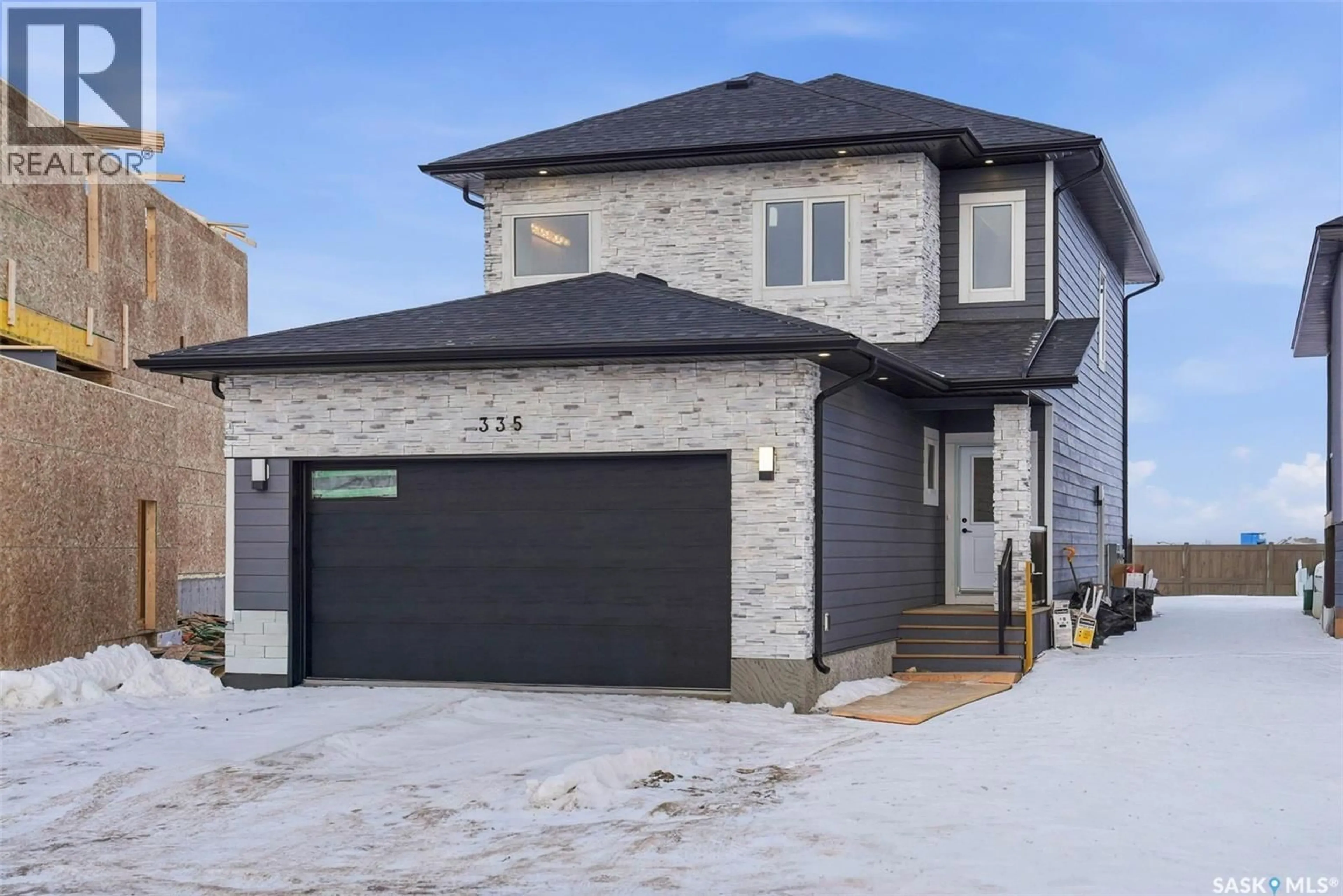 Home with brick exterior material, street for 335 SHARMA CRESCENT, Saskatoon Saskatchewan S7W1J1