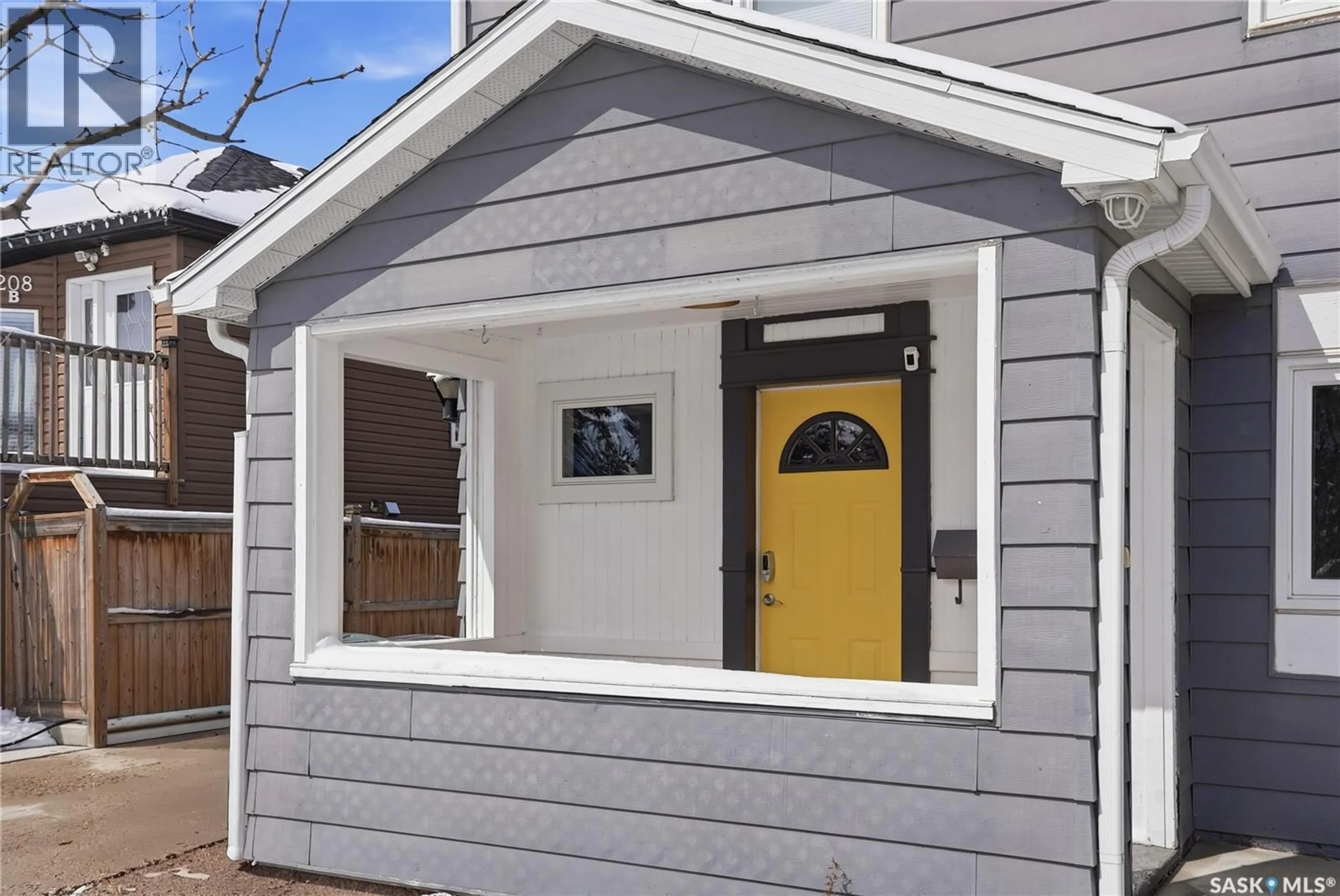 Home with vinyl exterior material, street for 210 CRUISE STREET, Saskatoon Saskatchewan S7N2C3