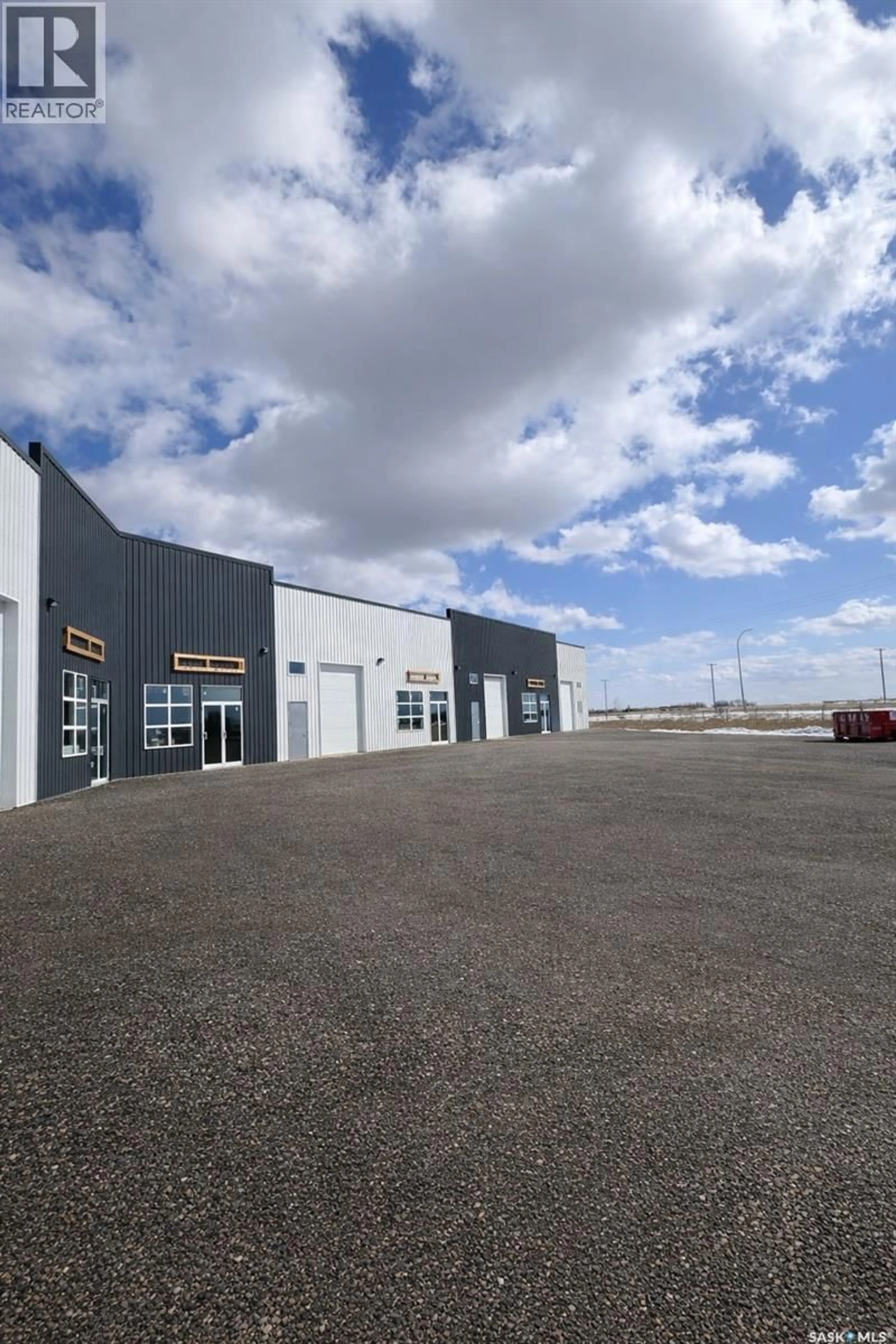 A pic from outside/outdoor area/front of a property/back of a property/a pic from drone, building for 9&10 - 213 SERVICE ROAD, Langham Saskatchewan S0K2L0