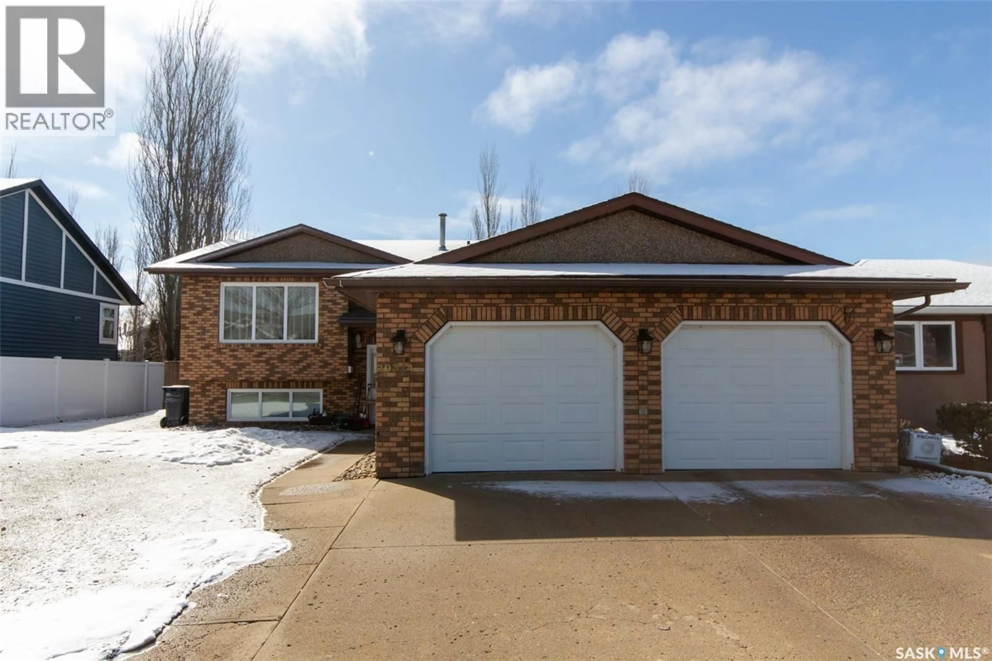 Home with brick exterior material, street for 10314 BUNCE CRESCENT, North Battleford Saskatchewan S9A3Y4