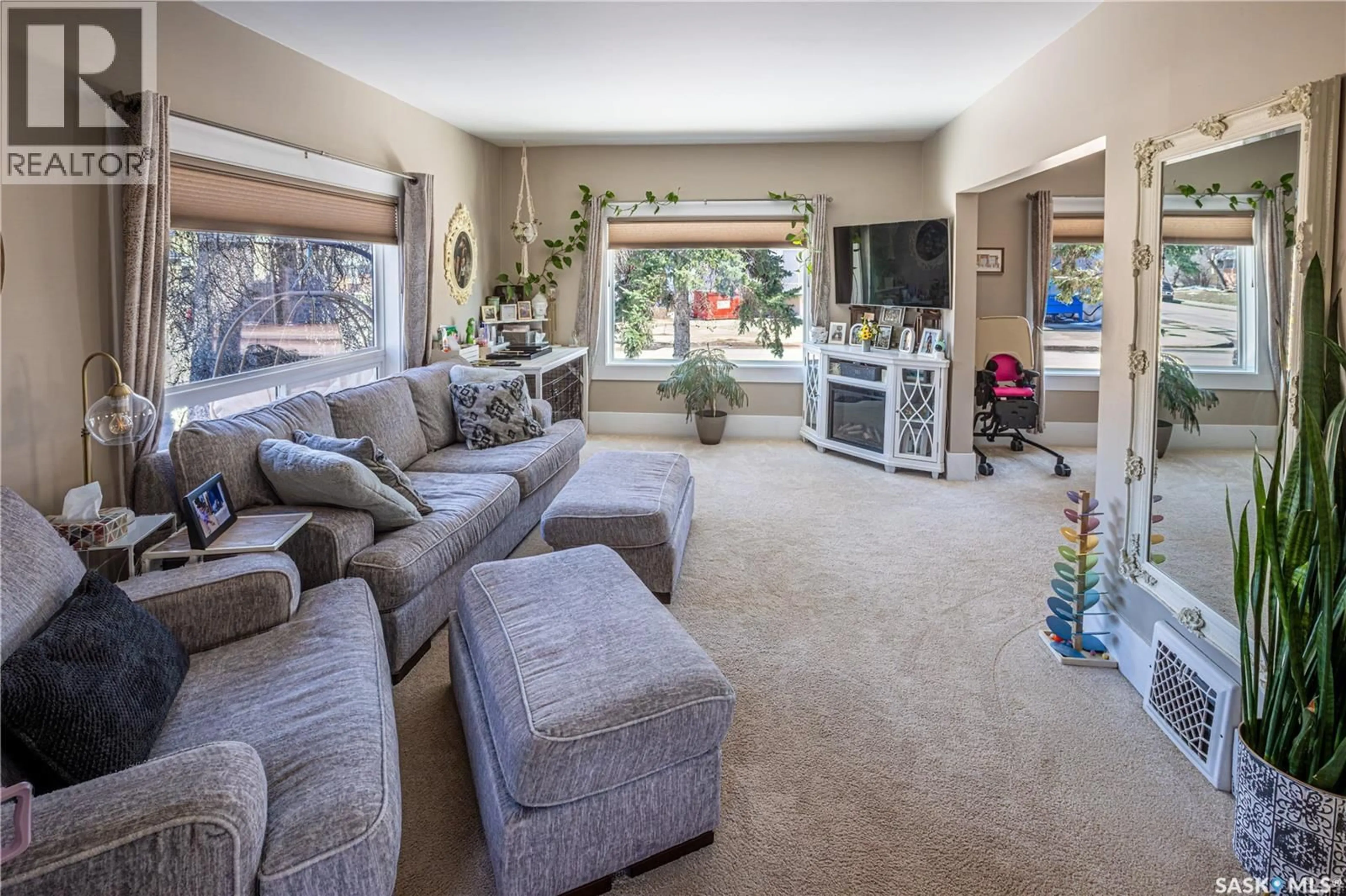 Living room with furniture, carpet floor for 201 ATHABASCA STREET, Moose Jaw Saskatchewan S6H2B8