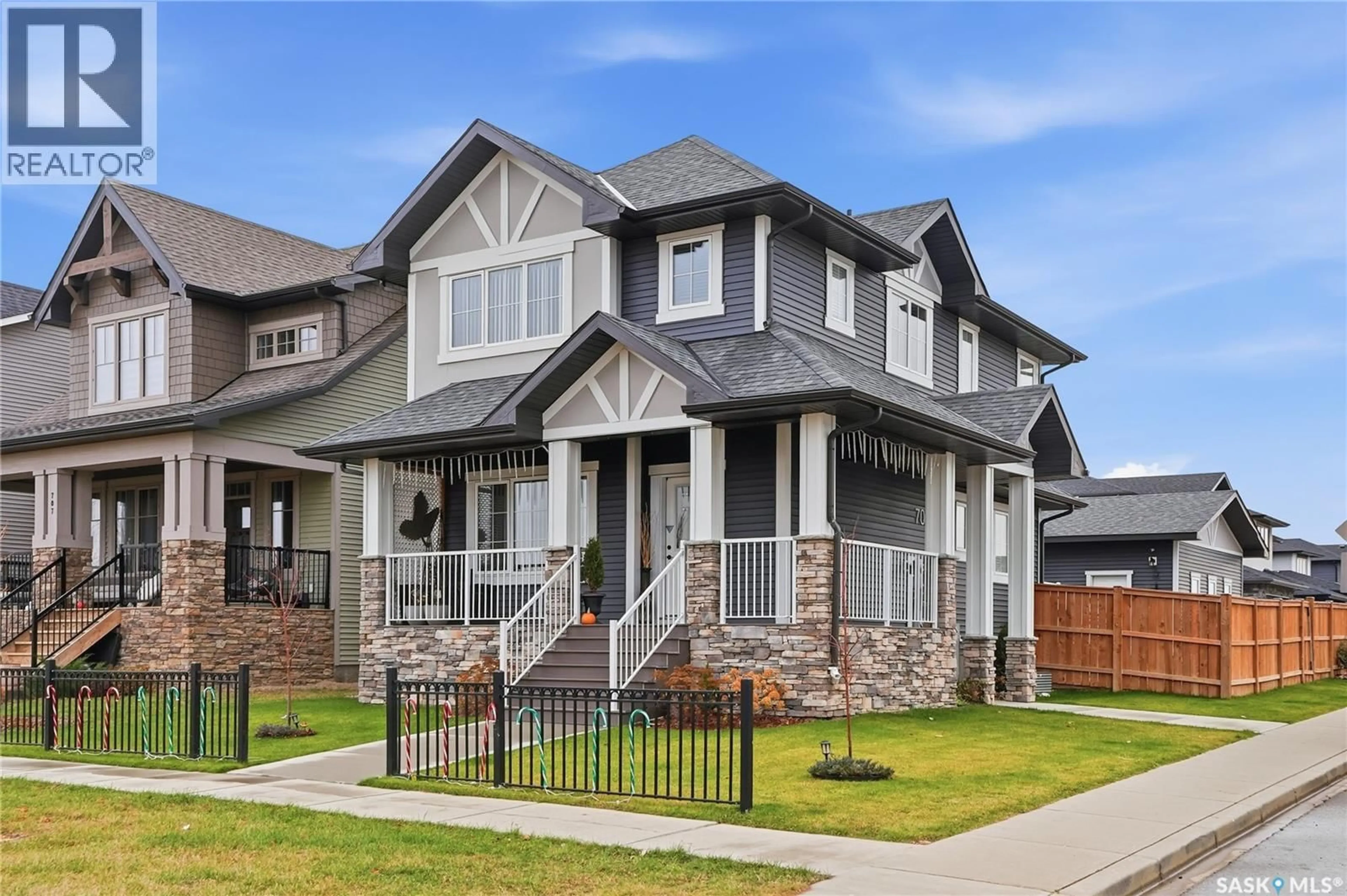 Home with vinyl exterior material, street for 703 UNDERHILL LANE, Saskatoon Saskatchewan S7V0N2