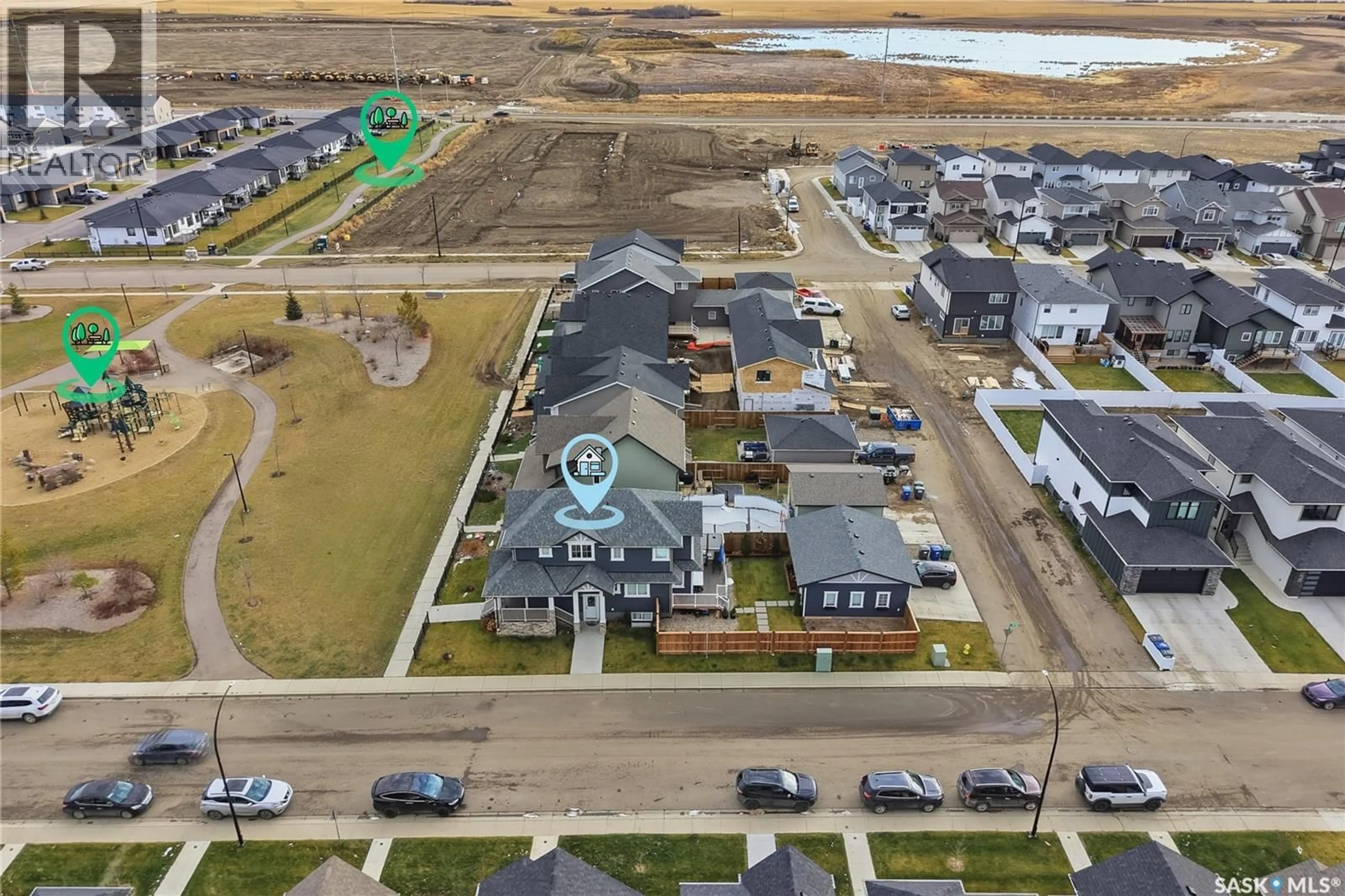 A pic from outside/outdoor area/front of a property/back of a property/a pic from drone, water/lake/river/ocean view for 703 UNDERHILL LANE, Saskatoon Saskatchewan S7V0N2