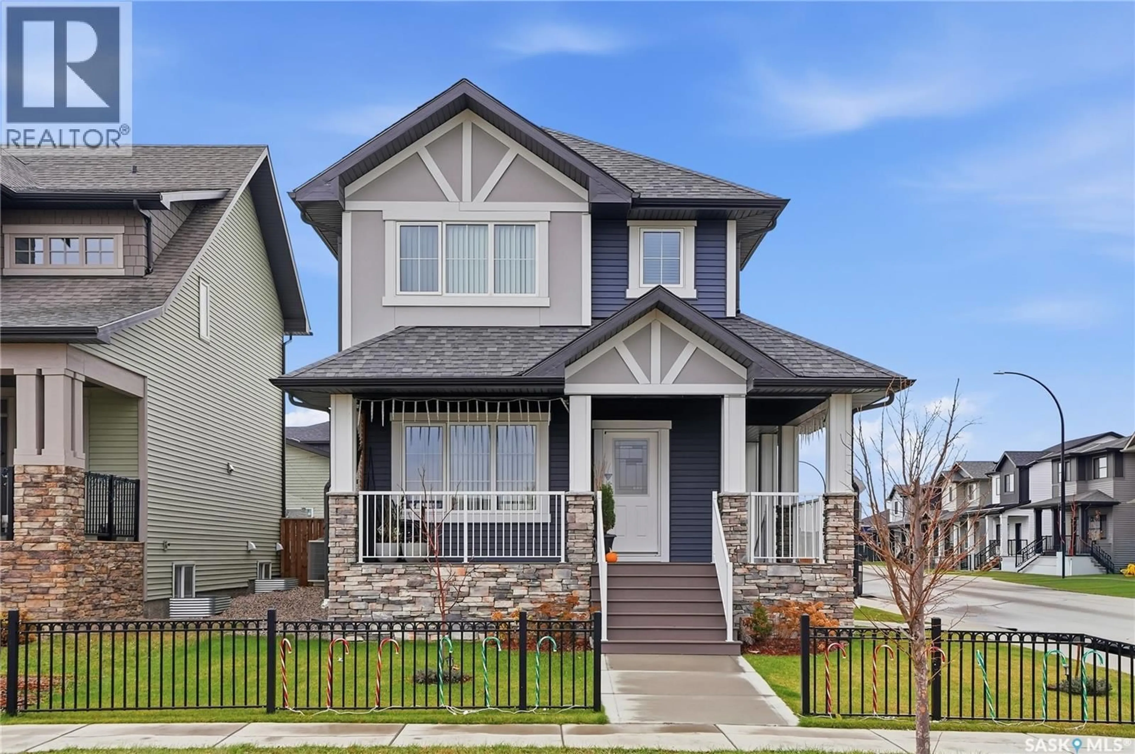 Home with vinyl exterior material, street for 703 UNDERHILL LANE, Saskatoon Saskatchewan S7V0N2