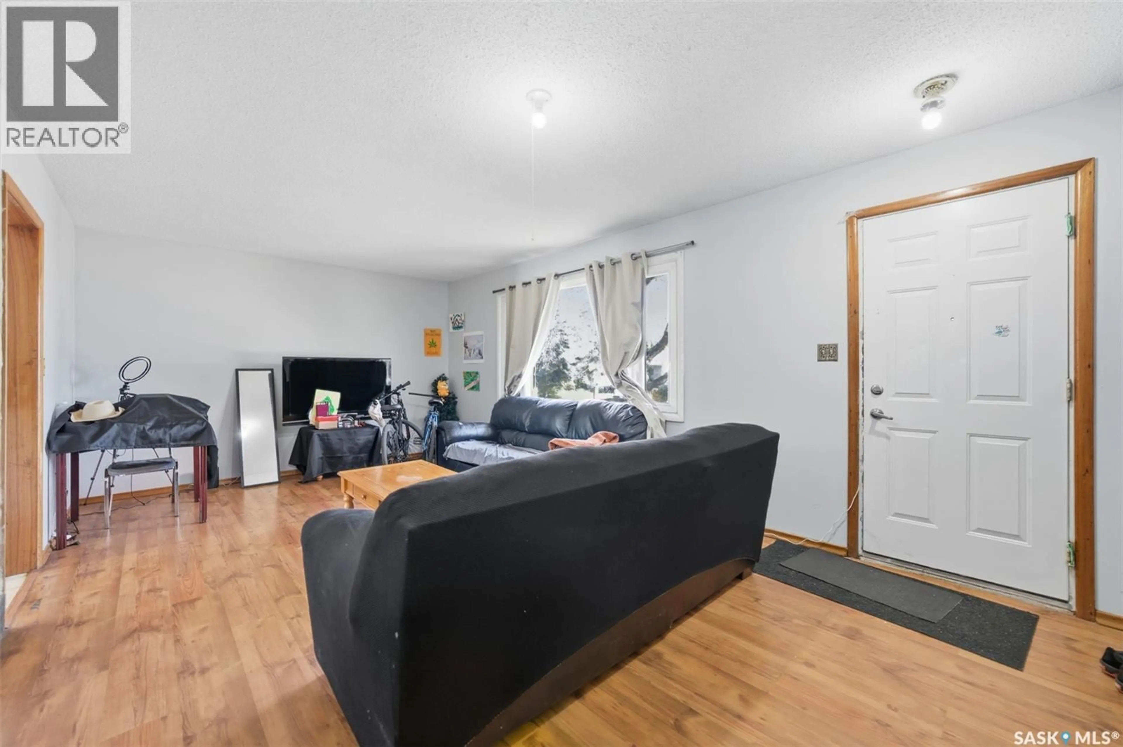 Living room with furniture, unknown for 1051 109TH STREET, North Battleford Saskatchewan S9A2E3