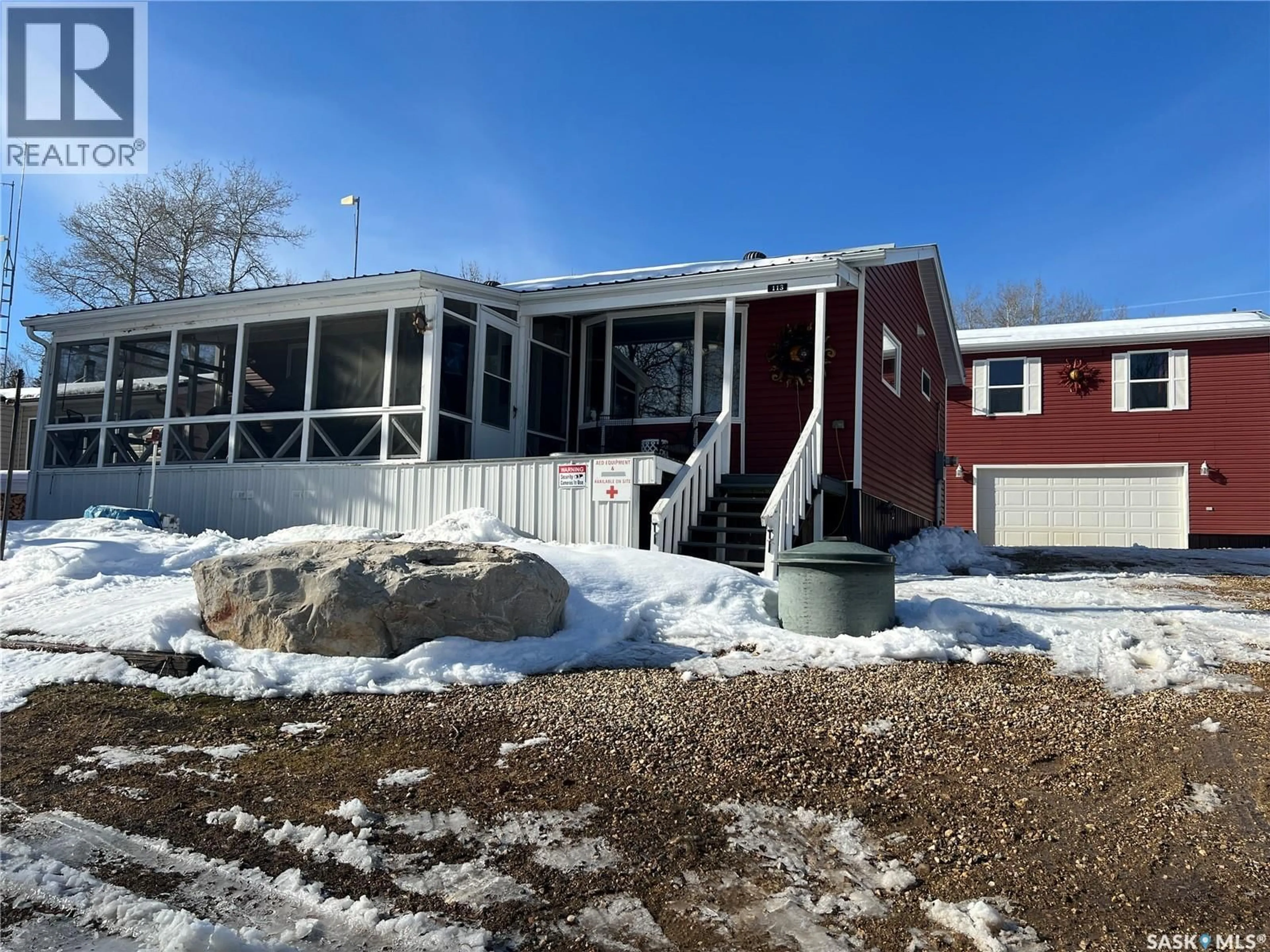 A pic from outside/outdoor area/front of a property/back of a property/a pic from drone, building for 113 POPLAR CRESCENT, Hudson Bay Rm No. 394 Saskatchewan S0E0Y0