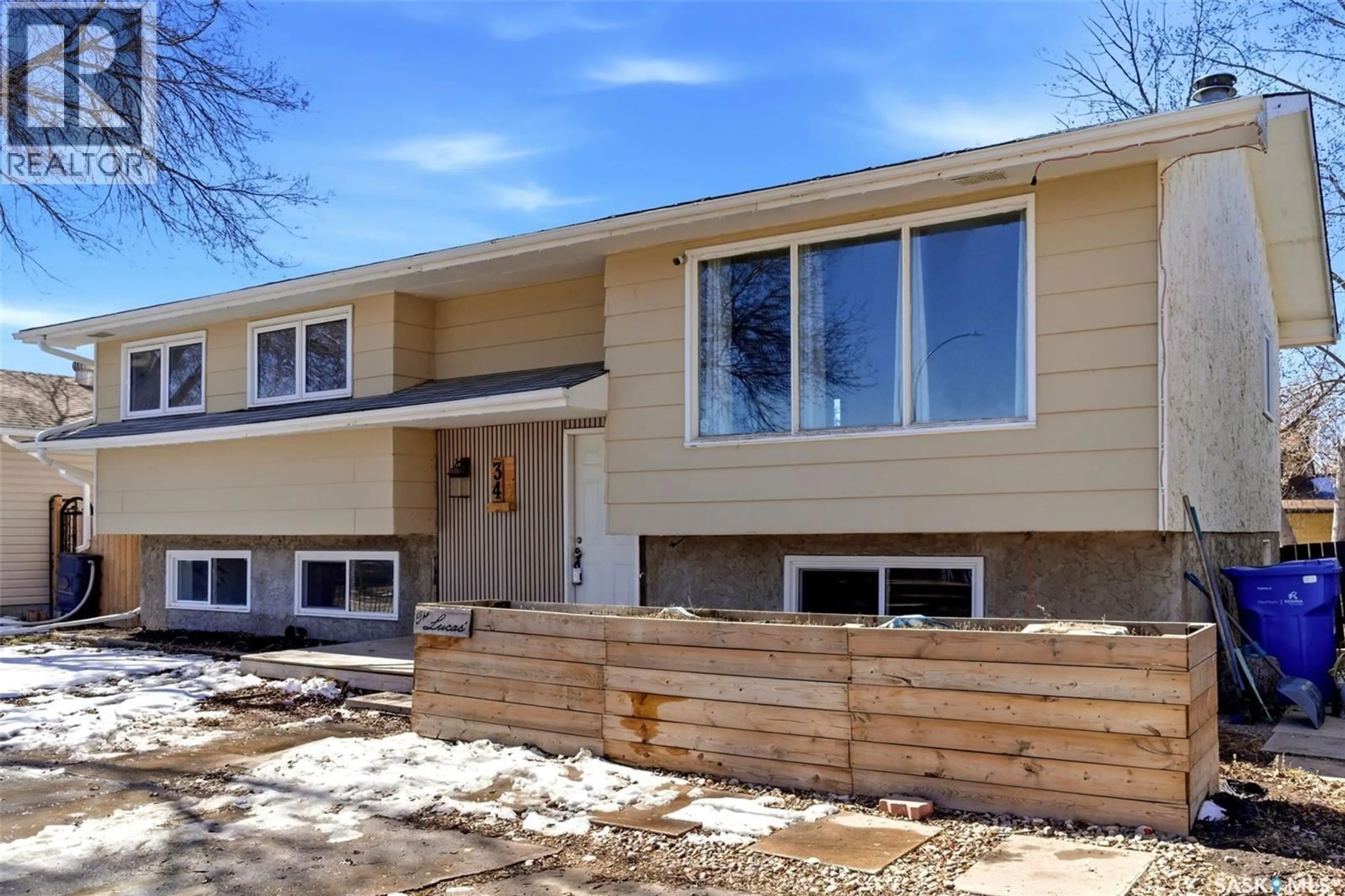 Home with vinyl exterior material, street for 34 GLASGOW STREET, Regina Saskatchewan S4X1E1