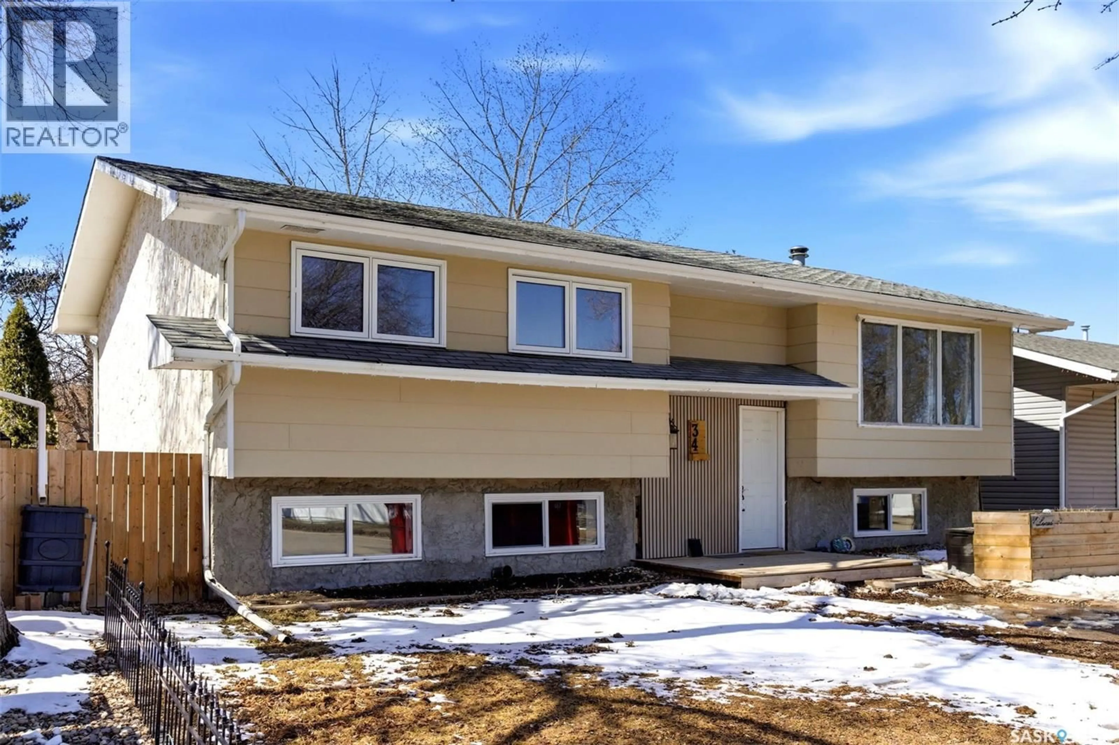 Home with vinyl exterior material, street for 34 GLASGOW STREET, Regina Saskatchewan S4X1E1
