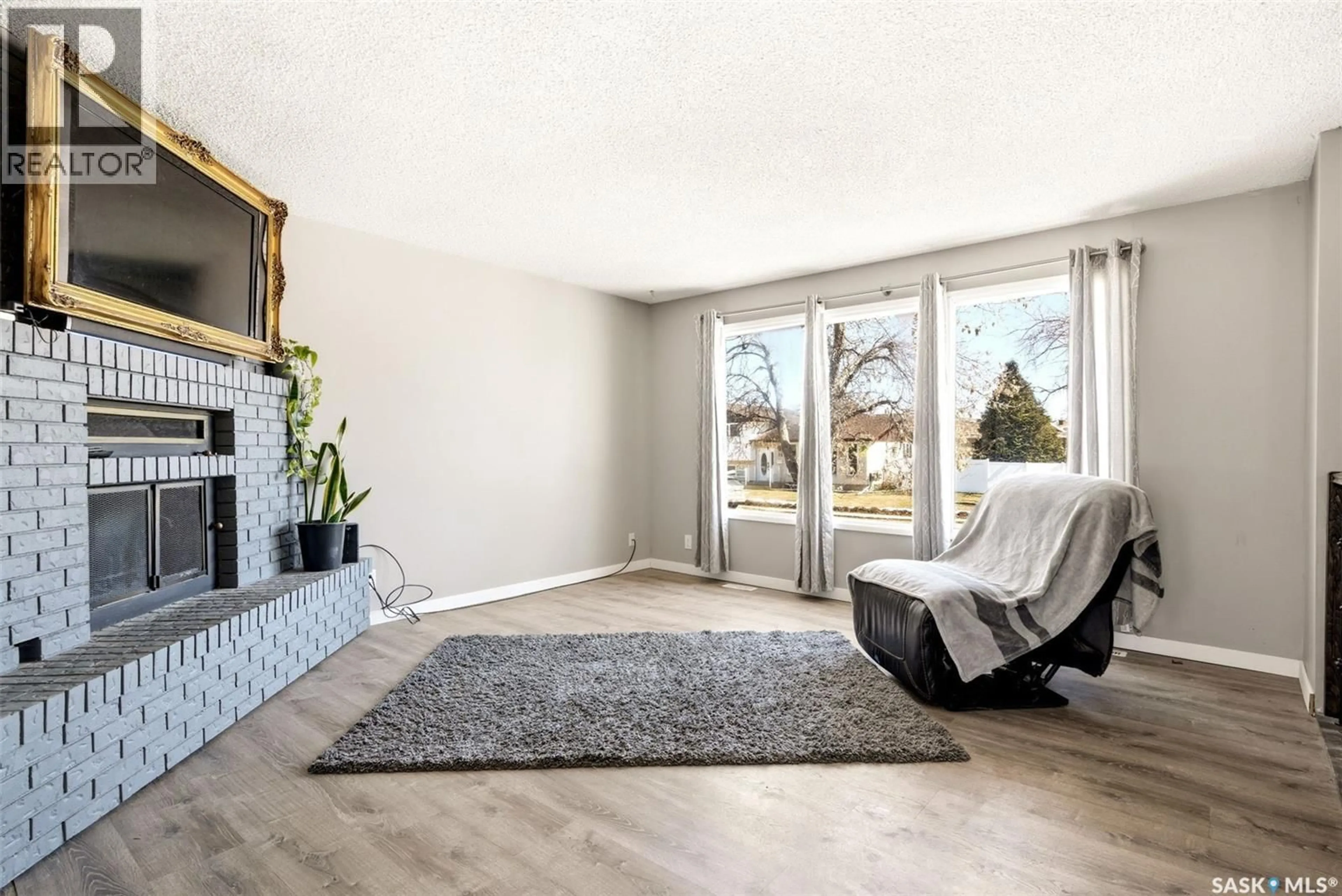 Living room with furniture, unknown for 34 GLASGOW STREET, Regina Saskatchewan S4X1E1