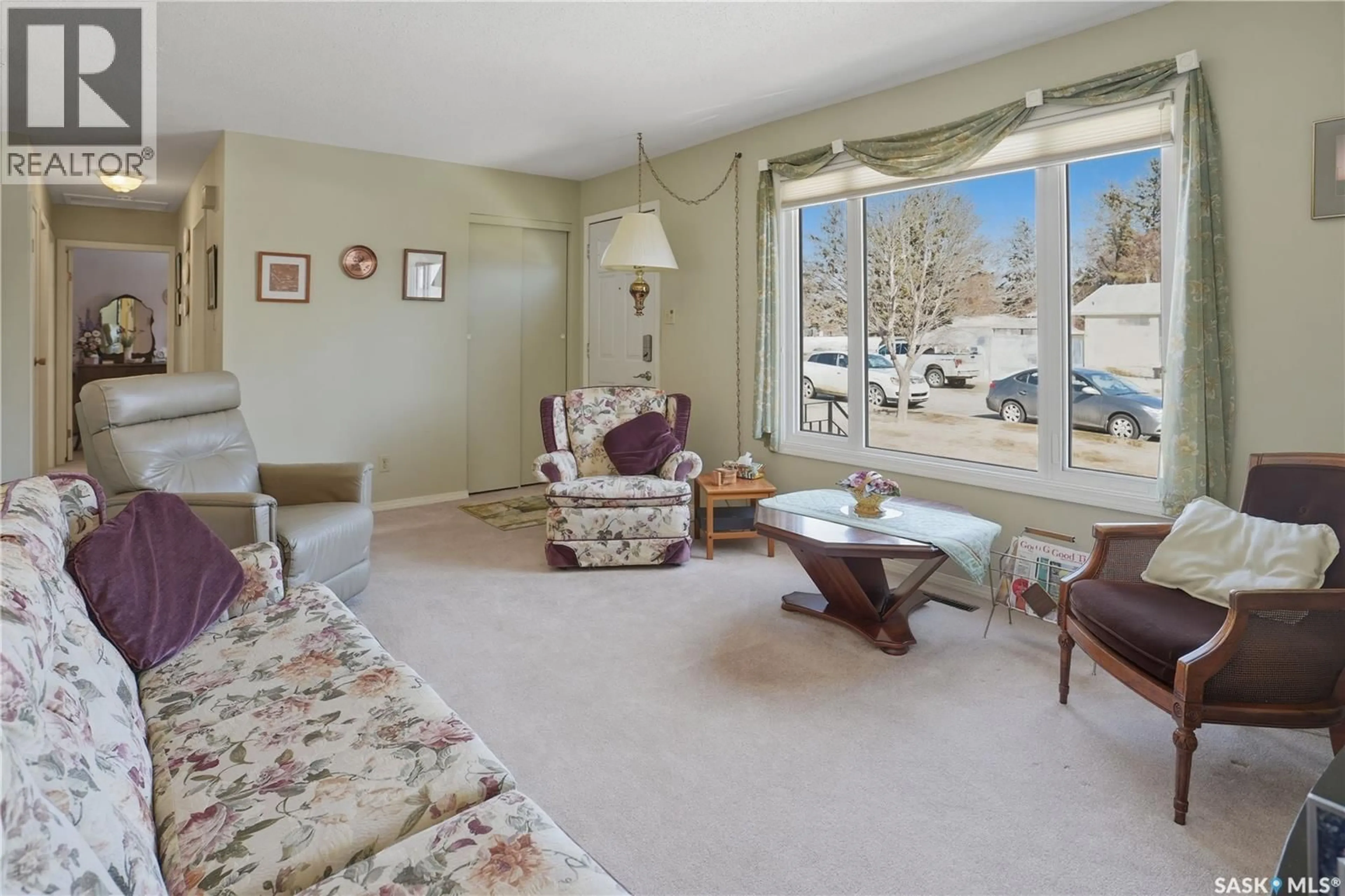 Living room with furniture, carpet floor for 1551 MACKENZIE KING CRESCENT, North Battleford Saskatchewan S9A3C5