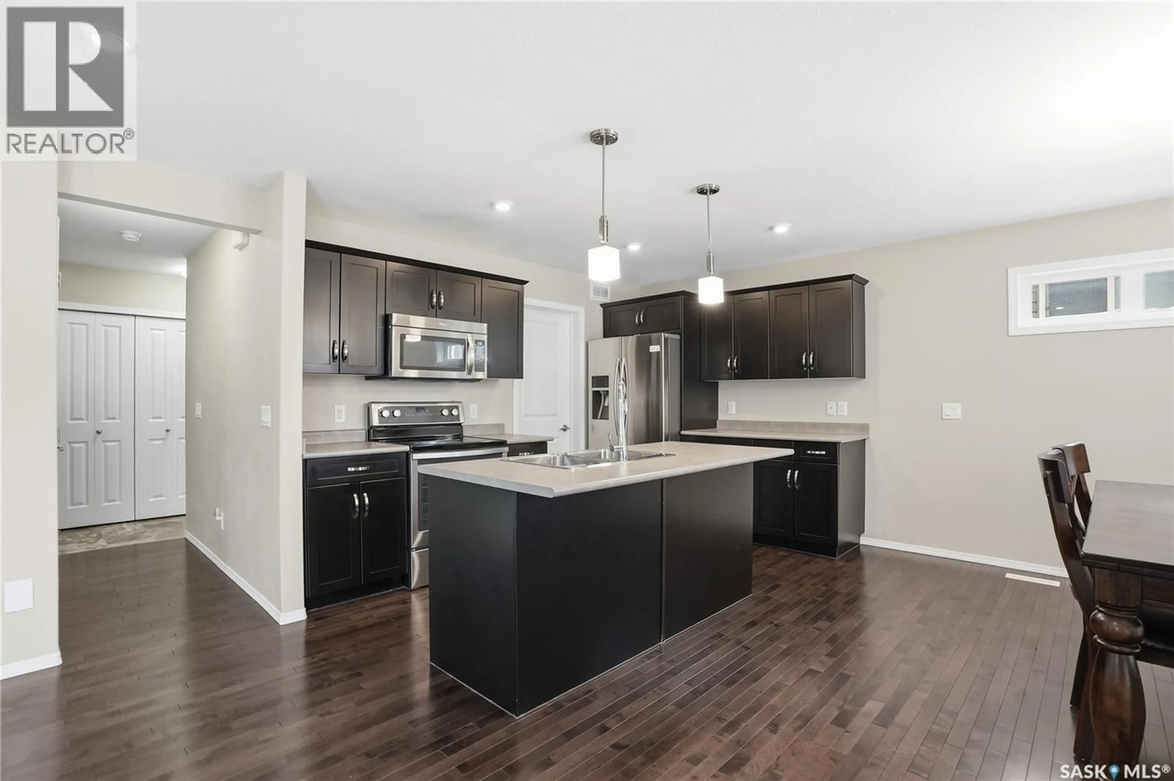 Open concept kitchen, wood/laminate floor for 366 KOLYNCHUK MANOR, Saskatoon Saskatchewan S7T0W4