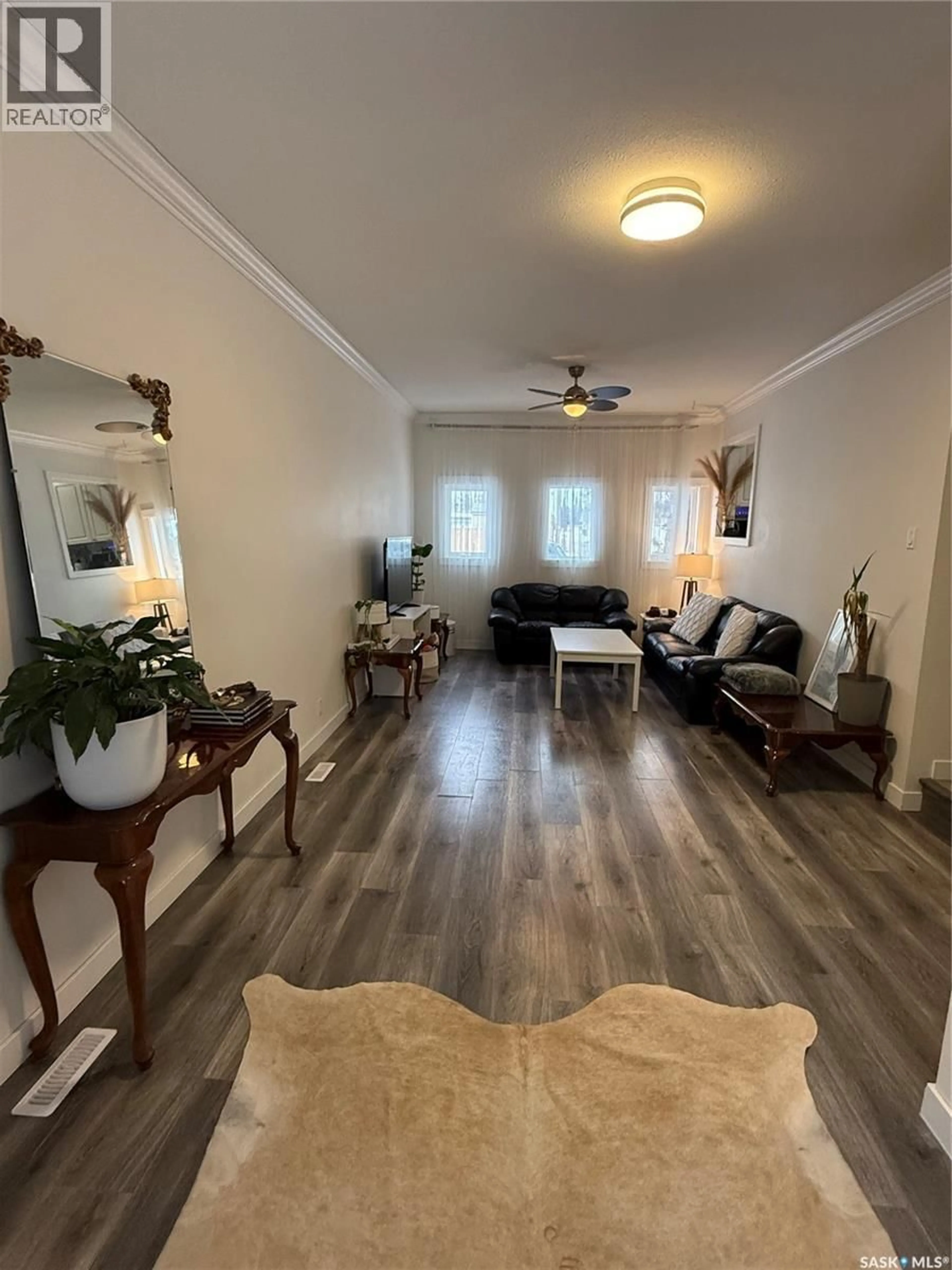 Living room with furniture, wood/laminate floor for 804 6TH STREET, Nipawin Saskatchewan S0E1E0