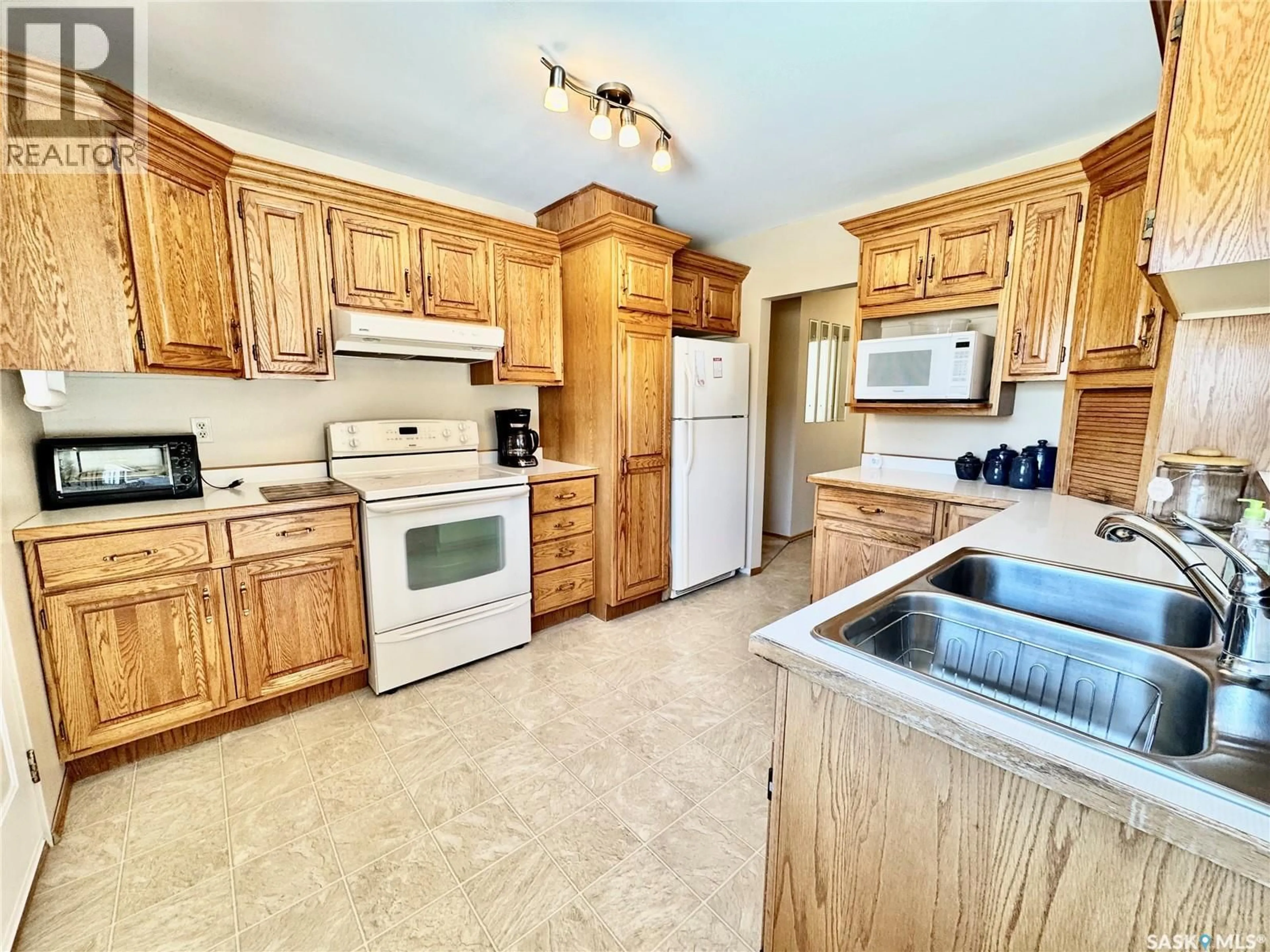 Standard kitchen, ceramic/tile floor for 703 AGNEW STREET, Prince Albert Saskatchewan S6V2P2