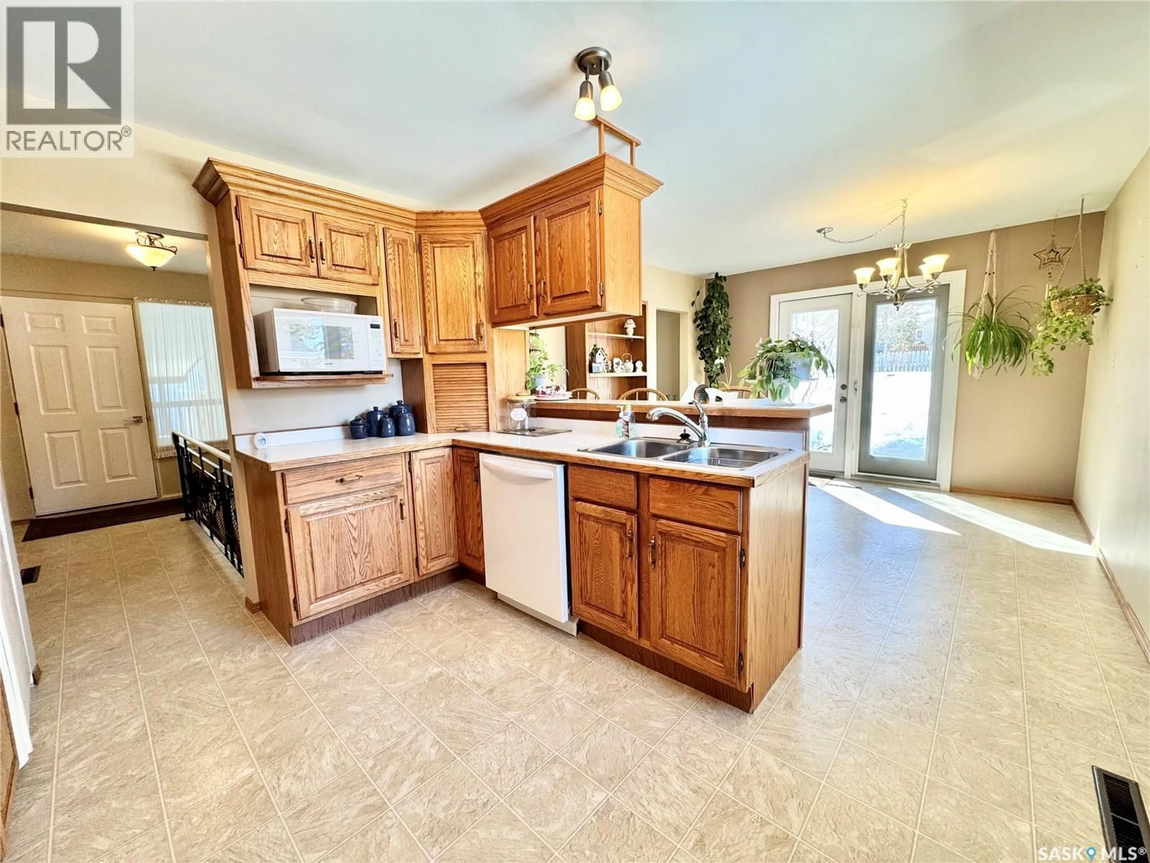 Open concept kitchen, ceramic/tile floor for 703 AGNEW STREET, Prince Albert Saskatchewan S6V2P2