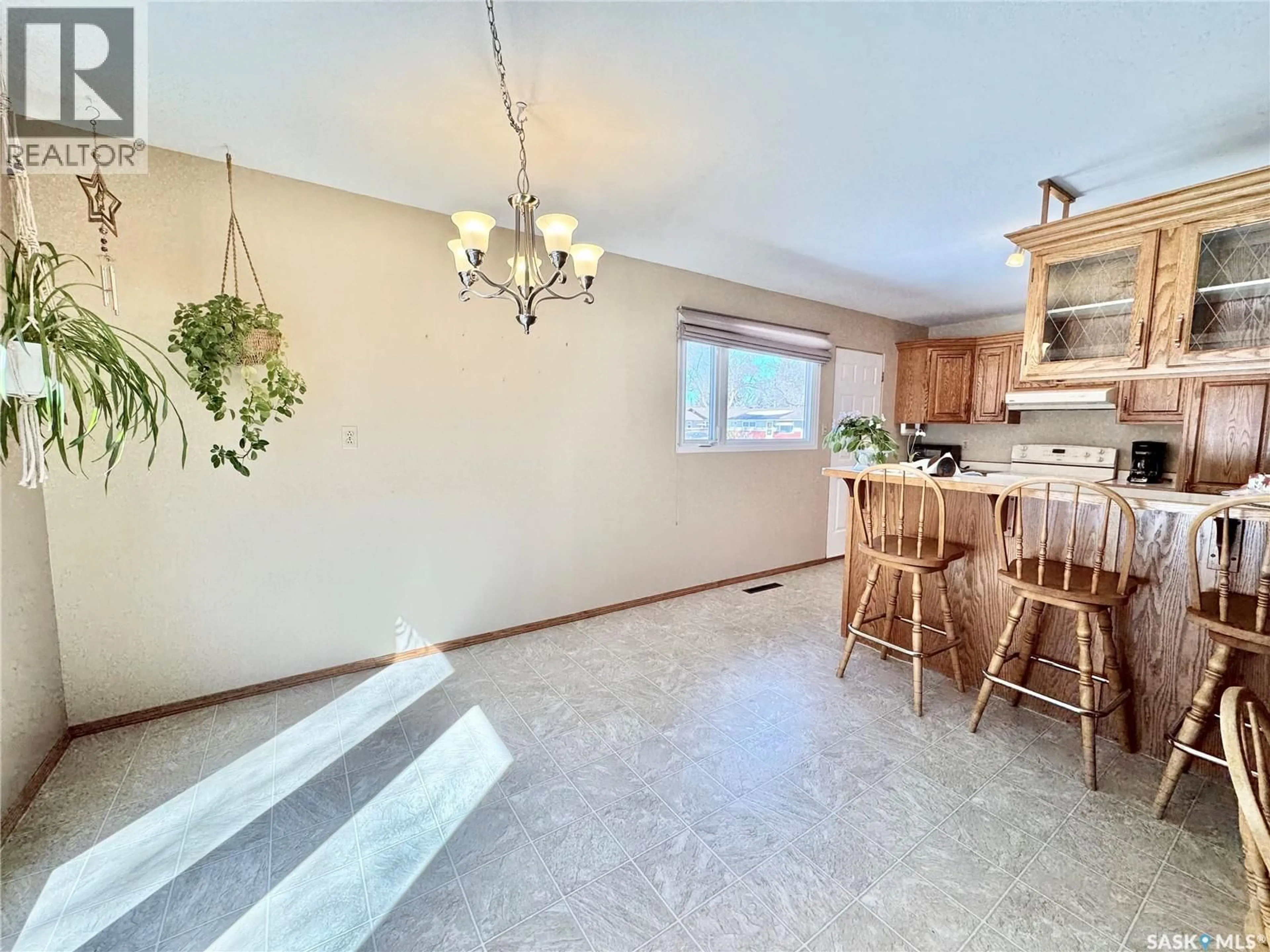 Open concept kitchen, ceramic/tile floor for 703 AGNEW STREET, Prince Albert Saskatchewan S6V2P2