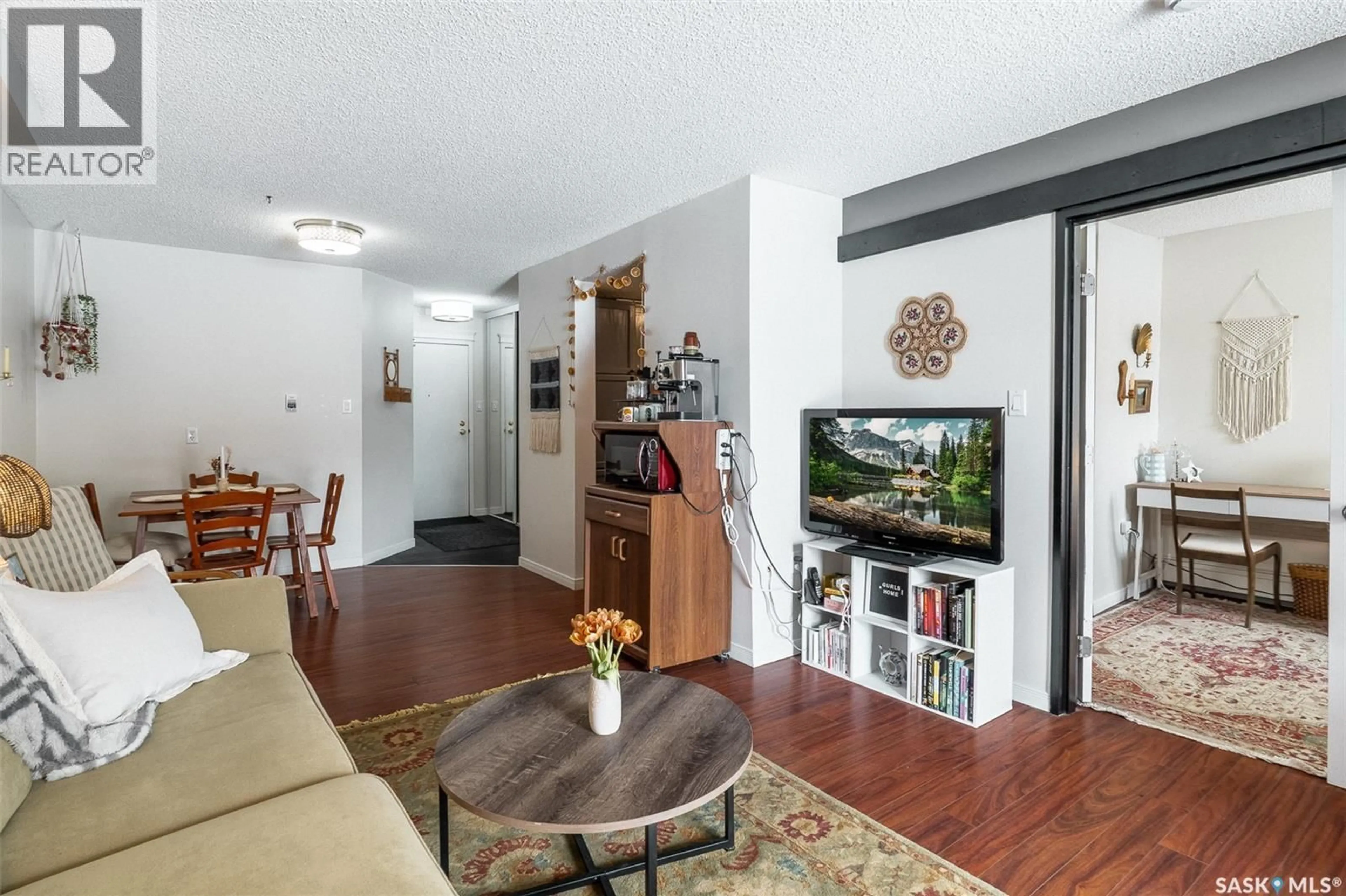 Living room with furniture, wood/laminate floor for 112 - 3420 PARK STREET, Regina Saskatchewan S4V2M9