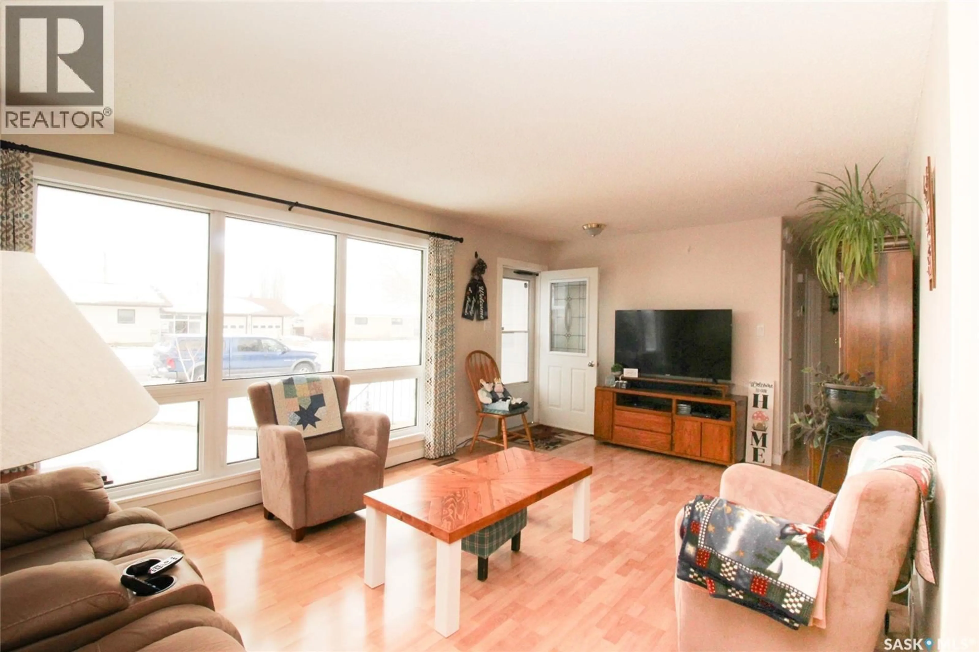 Living room with furniture, wood/laminate floor for 612 9TH STREET, Shaunavon Saskatchewan S0N2M0