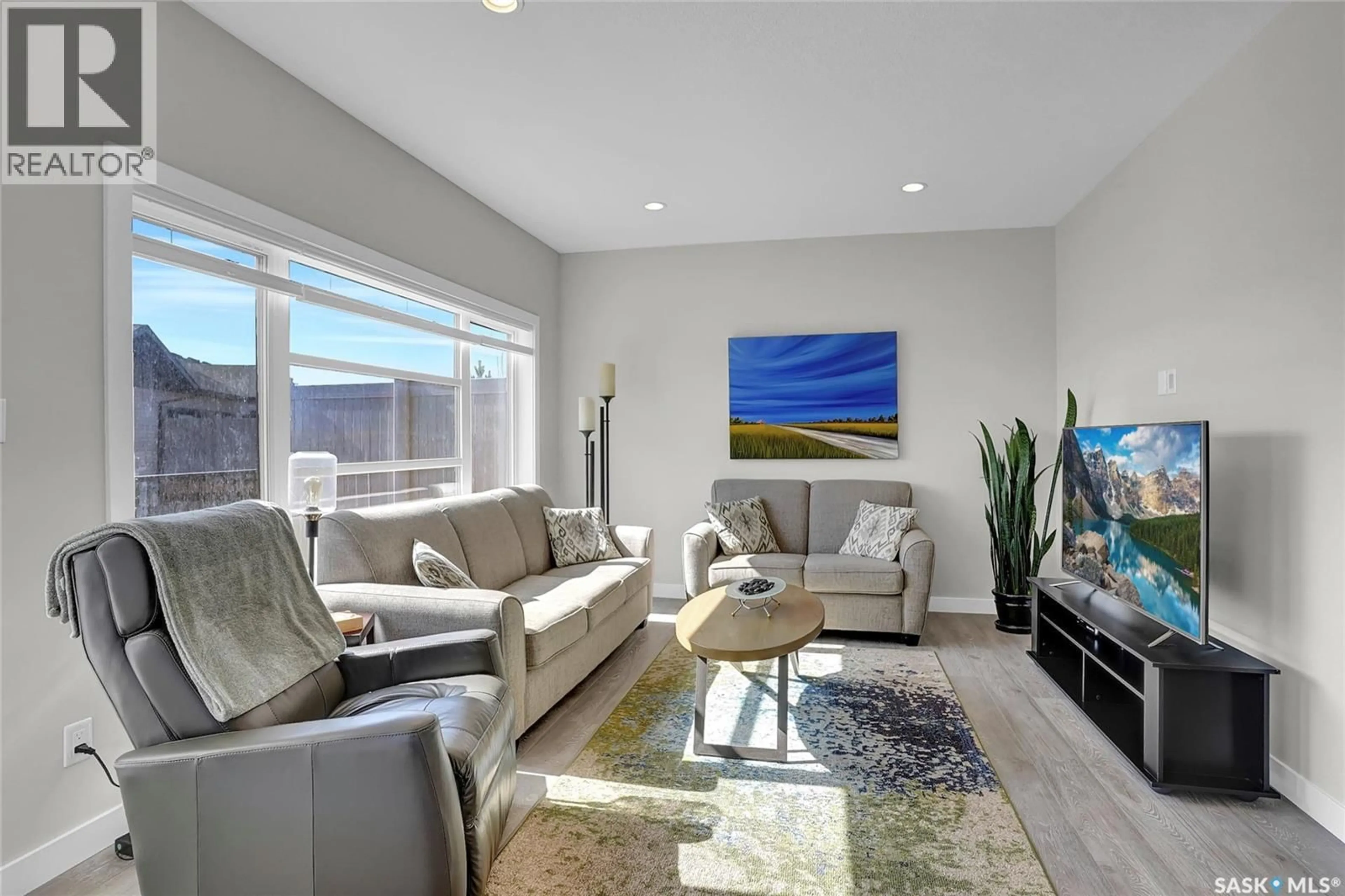 Living room with furniture, unknown for 107 - 3960 GREEN FALLS DRIVE, Regina Saskatchewan S4V3T5